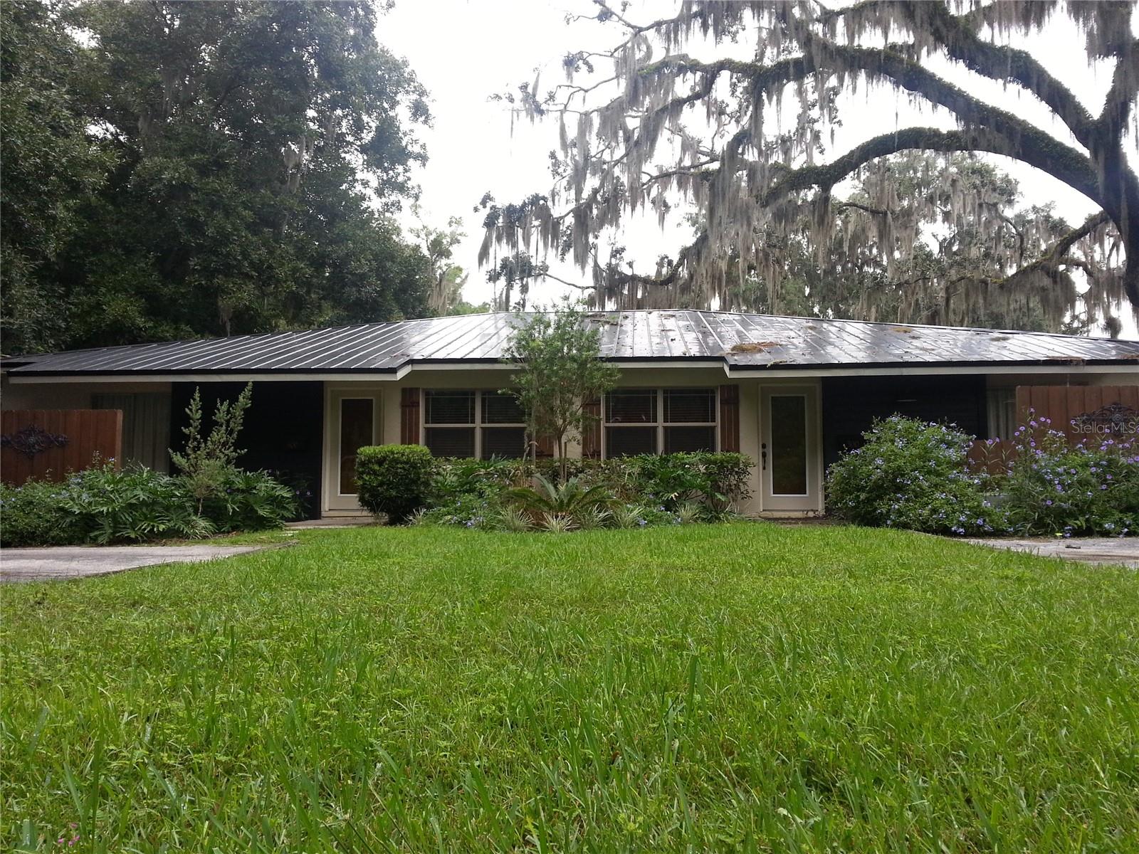 FULLY FURNISHED "The Stables Downtown" is a small, quiet residential complex for professionals who don't need a lot of space, but enjoy the luxury in the details and the prime location and environment. These premium flats are nestled in the heart of Ocala's prized Historic District among grand historic estates, with three unfurnished flats on annual lease, plus one set up as a high-end furnished rental (hypo-allergenic-free of fragrances). Each flat is roughly 756 square feet of well laid out living space with two bedrooms and one bath. Tiny in size, but huge in details and amenities, each flat is a perfect little nook that comfortably suits up to 'two and a half' full-time persons while maintaining luxury and leaving nothing to be desired. Master bedrooms are the larger of the two which easily fit a king sized bed with sliders to private patios. The easily accessed single story concrete structure provides a great amount of privacy similar to a house or condo, but doesn't come with the extra maintenance of renting a house. Flats have their own private parking spaces at no additional charge. This unique complex was completely overhauled into gorgeous new, well thought out, designer spaces with custom cabinetry and lighting, quartz counters, laminate wood floors, etc. Design inspiration was taken from The Biltmore Castle & Stables in Asheville, NC with warm tones, a touch of French flair and a vibe that celebrates Ocala's deep seeded love for horses. Rent covers water utility (not electric), grounds maintenance, & quarterly pest prevention. A full-sized Whirlpool washer & dryer is also included in the appliances inside each flat. Furnished Flat #300 is stocked similar to a VRBO & has 'dressed down' option for small, well-trained/groomed dog consideration. This subdued gem in hiding is just a short walk or bike ride to the market, the square and all the best that downtown Ocala has to offer! Waiting list applicants are also accepted anytime throughout the year. Feel free to contact owner if interested in holding a space for a later opening. Complex, tenants and grounds are 100% non-smoking/non-vaping. The tastefully furnished and stocked Flat#300 at $1800/month is available now. Rate discounts for qualifying first responders & teachers. Owner does not charge app fees or any other hidden fees but asks for serious inquiries only, please. Owner/Landlord does all pre-screened showings, apps & approvals. Owner/Manager is also a Licensed Real Estate Broker in the state of Florida with a track record of taking good care of Tenants.