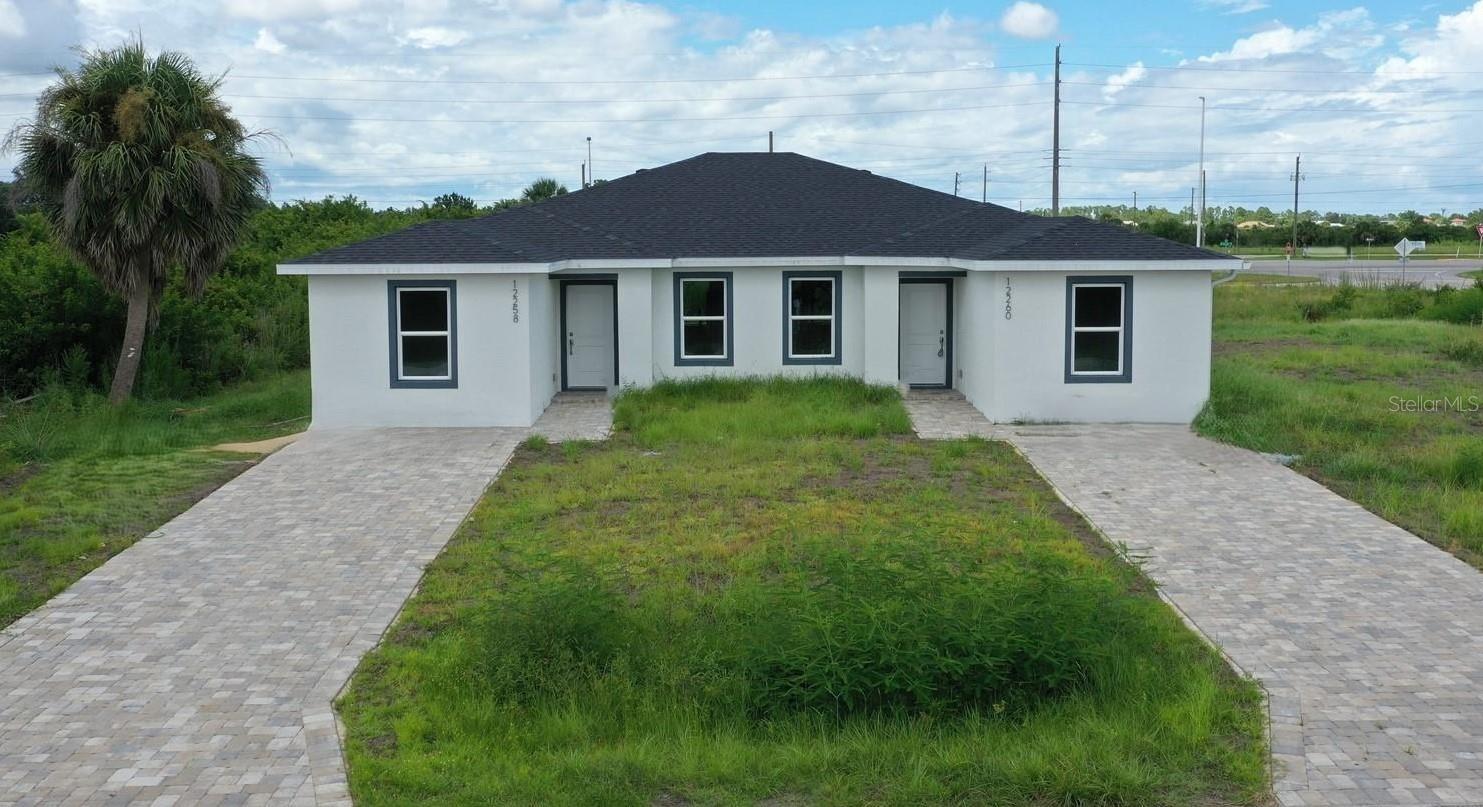 Brand New DUPLEX in Port Charlotte - Never lived in! Each Family Friendly Unit features 3 bedrooms & 2 bathrooms with 1162sq of Air-conditioned living space. Public Water and No HOA, No Deed Restrictions, NO CDD, and NOT in a Flood zone. Designed for comfort and style, each unit boasts a spacious Open Floor plan with Luxury Vinyl Plank flooring throughout. The kitchens have white shaker cabinets, quartz counters, stainless steel appliances, a breakfast bar PLUS a Dinette area. The Primary Suites feature Ensuite bathrooms and walk-in closets. The 2 additional bedrooms and the 2nd bath provide plenty of space for Family & Friends! Each unit has an inside Laundry closet with Washer & Dryer Hookups. Sliders lead out to the covered Lanai and a Large Yard for outside Enjoyment. Located in a Quiet neighborhood across from a Golf Course and Close to the Beautiful Gulf Beaches of Boca Grande and Manasota Key/Englewood Beach, shopping, restaurants, and entertainment. Buy as a dual rental investment, or live in one side & rent the other to help with your expenses, or enjoy the convenience of Multi-Generational Living by having family next door. Don’t miss this Prime Investment Opportunity – schedule your showing today!