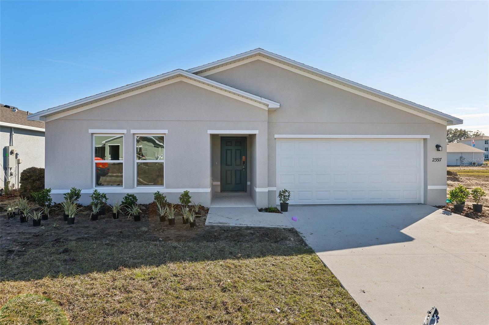 Be charmed by this new construction home in vibrant Port Charlotte! The Prescott Plan features an airy open layout with a seamless transition between the Living Room, a well-equipped Kitchen, and a separate Dining Area, ideal for entertaining. The kitchen stands out with its beautiful cabinetry, granite countertops, and stainless steel appliances, including a range with a microwave hood and dishwasher.
The serene primary suite includes a private bath with dual vanity sinks and a generous walk-in closet. Additional highlights include a convenient two-car garage, and energy-efficient Low-E insulated dual-pane vinyl windows. A one-year limited home warranty. Move-in Ready! No HOA! Seller Offering Concessions! Your dream home awaits!