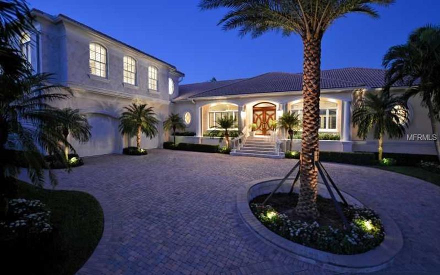 Bay front Elegance with Palm Beach flair is the style of this stunning waterfront beauty.  Two master suites and a luxurious guest bedroom all overlook sparkling Bay waters and twinkling downtown city lights. A study/4th bedroom has a closet and en-suite bath with a private patio. Large open kitchen and living areas are highlighted with wood floors, granite surfaces and a gas fireplace with custom cabinetry in the family room.  Exterior spaces are calming and tranquil complete with spacious and inviting entertaining  marble deck area, heated spa and infinity-edge pool that creates endless water views on 257 feet of seawall. The over sized boat dock will please the boater along with a super size two-car garage with marble floors will delight the car buff too. An absolute must see!