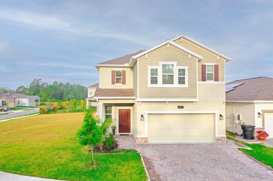 Stunning 4-Bedroom Home on Oversized Corner Lot in Providence Golf Community! Welcome to 3027 Camden Way, a beautifully upgraded 4-bedroom, 2.5-bathroom home nestled in the highly sought-after gated golf course community of Providence in Davenport, FL. Sitting on an oversized corner lot, this home boasts an array of premium upgrades and modern features designed for luxury and convenience. Inside, you'll find luxury vinyl flooring throughout, crown molding, stylish kitchen pendant lights, upgraded ceiling and bathroom lighting, and an elegant stair-handrail. The gourmet kitchen is complete with upgraded solid wood cabinets with crown molding, hardware door handles, Quartz Countertops, back-splash and stainless-steel appliances. The primary bedroom features an en-suite shower and garden tub combo with an upgraded ample custom closet, providing exceptional storage and organization. Followed by large guest bedrooms with installed sleek ceiling fans. Exterior enhancements include a water softener system, gutters, an extended paved driveway and garage, a side paved walkway. Located in a resort-style community with world-class amenities, including a championship golf course, clubhouse, pools, fitness center, tennis courts, and more, this home offers the perfect blend of elegance, comfort, and convenience. Don't miss this opportunity—schedule your private showing today!