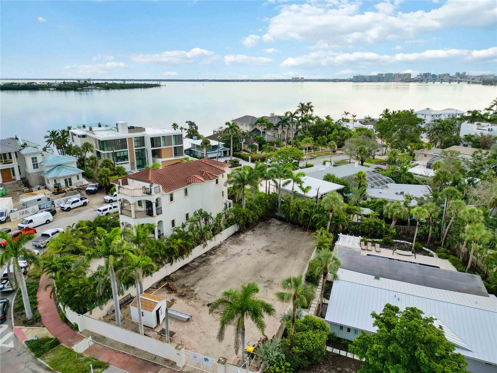 Seize a rare opportunity to own and build on Sarasota’s iconic St. Armands Key. Just steps from the boutiques and dining of St. Armands Circle and the white sands of Lido Beach, this 7,657 sq. ft. homesite (RSF-2 zoning) has been fully prepped and is truly ready to go. The sellers have already invested the time and resources: demo has been permitted and completed, the lot is cleared, utilities are available, and full architectural site plans are included.
Adding to this turnkey advantage, a licensed Sarasota-based Certified General Contractor is aligned and ready to build. For a buyer, this removes one of the hardest hurdles in today’s market—securing a trusted GC with availability. Whether moving forward with the included coastal luxury design or creating something entirely custom, the path to construction is streamlined from day one.
Surrounded by new construction homes commanding $4M–$6M+, this parcel is competitively positioned at $1.295M. For the developer, the ROI math is compelling: plans in place, CGC aligned, and seasonal demand building as feeder markets flow into Sarasota. For the retail buyer, it is a chance to create a dream home in a neighborhood where lifestyle and legacy meet—walking distance to the Circle, the beach, and the unmatched energy of Sarasota’s waterfront living.
This is more than land—it’s a build-ready, shovel-ready opportunity to deliver your vision on one of Florida’s most iconic Keys.