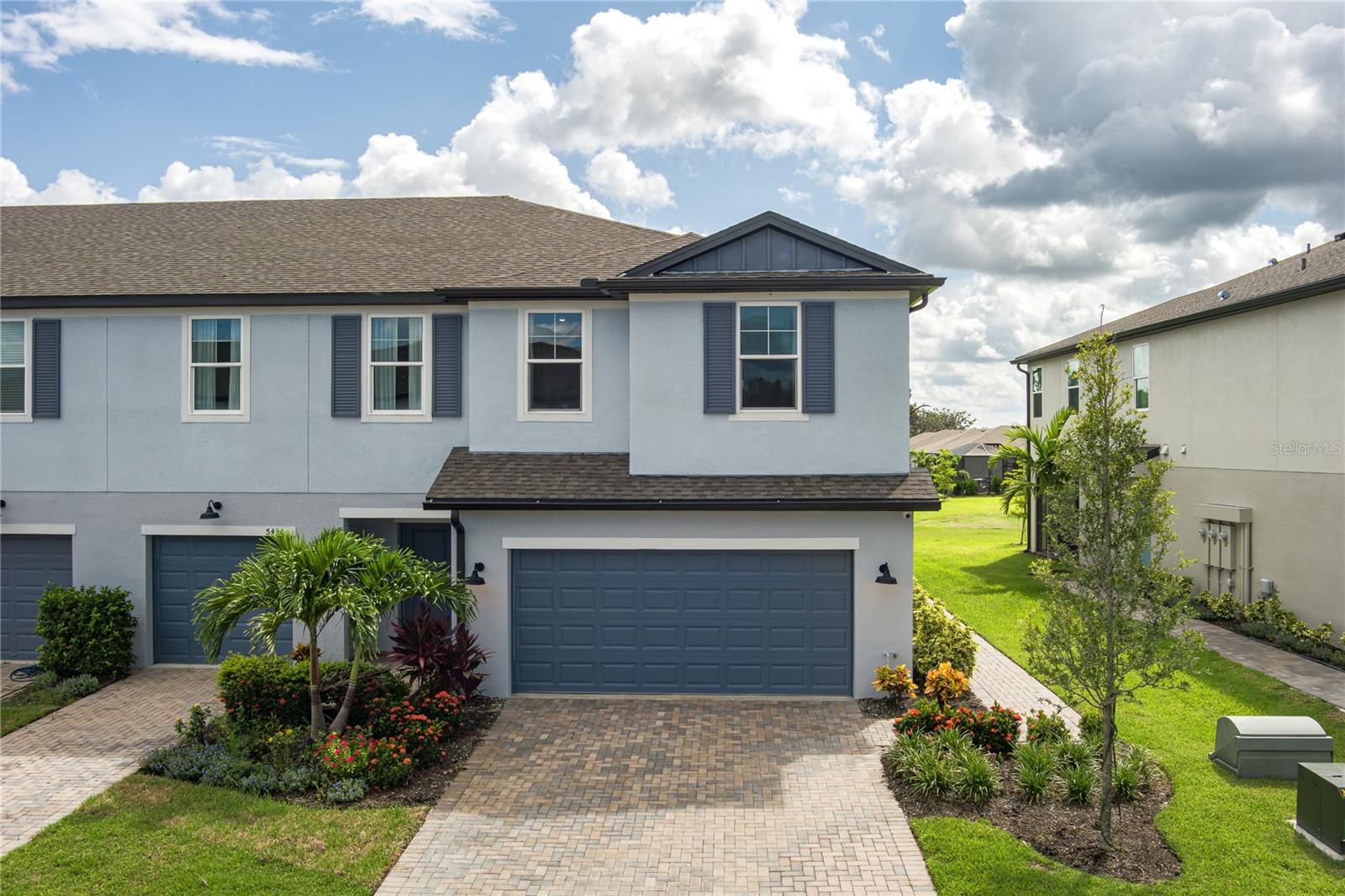 Available Now – Brand New 3-Bedroom Townhome in The Palms at Trevesta. Be the first to live in this beautiful Sabal model end-unit townhome located in the resort-style community of Trevesta. This spacious home offers 1,860 square feet of modern living with 3 bedrooms, 2.5 bathrooms, a loft, and a 2-car garage. Step inside to an open-concept main floor featuring a half bath, a bright great room, and a gourmet kitchen with a center island, double basin sink, stylish cabinetry, and beautiful countertops. The dining area flows seamlessly into the living space, with large windows bringing in natural light. Enjoy relaxing on the enclosed lanai with peaceful pond and nature views, perfect for morning coffee or winding down after a long day. Upstairs, you’ll find a versatile loft area, the laundry room, and all three bedrooms. Two bedrooms share a full bathroom, while the owner’s suite offers extra privacy at the back of the home. The suite features a large walk-in closet and a bathroom with dual vanities and a glass-enclosed shower. As a resident of Trevesta, you’ll enjoy exclusive community amenities, including a fitness center, zero-entry pool, splash pad, playground, and an active clubhouse with planned events. Located near Anna Maria Island beaches, golf courses, nature preserves, shopping, and dining, this home combines convenience with resort-style living. Rent includes access to all community amenities. Available now—schedule your showing today.
