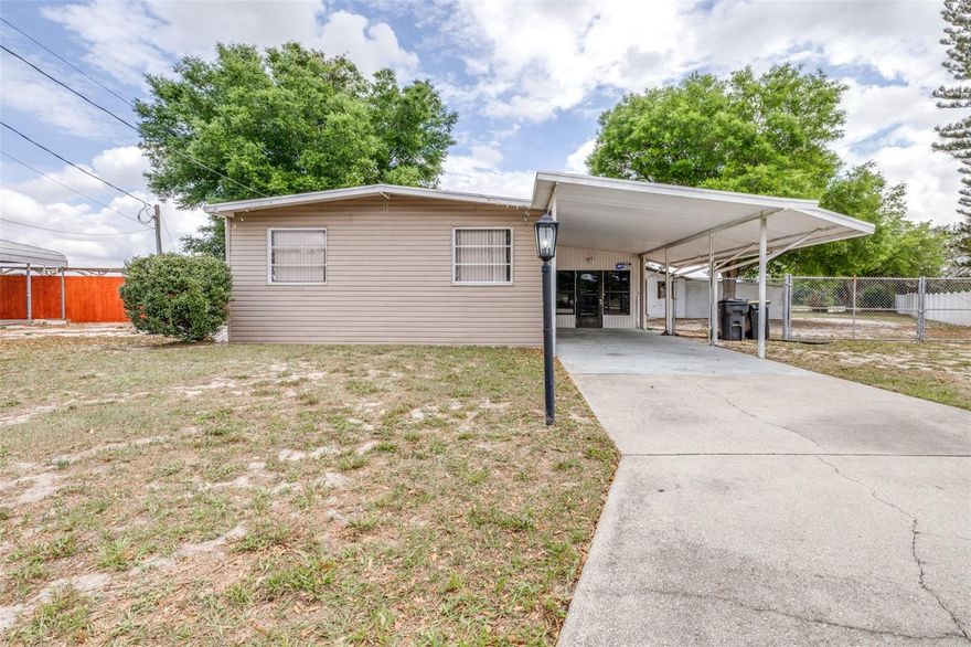 Located in Winter Haven, this 2 bedroom, 2 bathroom double wide mobile home sits on an oversized corner lot! The home offers a functional layout with comfortable living space and enclosed front porch. Both bedrooms have walk-in closets and the primary bedroom also has an en suite. The closed-in carport space offers extra functionality as a bonus room and also has an enclosed laundry room. The large corner lot has a fenced in backyard and also provides a detached workshop with AC unit perfect for storage, hobbies, and so much more! The neighborhood also has a boat ramp to Lake Fox for the boaters and fishing lovers! Conveniently located near shopping, dining, Legoland, and Hwy 27 for commuters, this is a great opportunity for a primary residence or investment property! Schedule a private tour today!