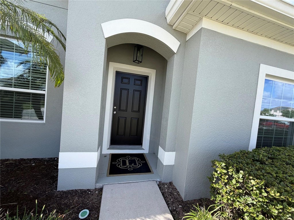 Photo of 12274 Sabal Palmetto Place, Orlando, FL 32824 (MLS # O6453022)