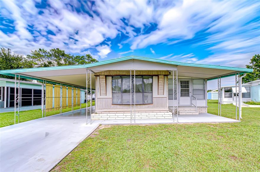 Welcome to Gem Estates, one of Zephyrhills’ sought-after 55+ communities! This charming 2-bedroom, 2-bath singlewide mobile home comes completely furnished and is truly move-in ready. The home features a split floor plan, offering privacy and comfort for you and your guests, one bedroom and bath on each side of the home. The inviting enclosed Florida room just off the living area adds valuable extra space that can serve as a TV room, sewing room, guest room, or entertainment area. The washer and dryer are conveniently located in the shed, which also provides plenty of storage space and shelving. Gem Estates is a pet-friendly community with low HOA fees that include water, giving you ease of living at an affordable price. Just minutes from downtown Zephyrhills, you’ll enjoy local shops, dining, and community events right at your doorstep. Don’t miss the chance to enjoy the relaxed Florida lifestyle in this well-maintained, furnished home. Schedule your showing today!