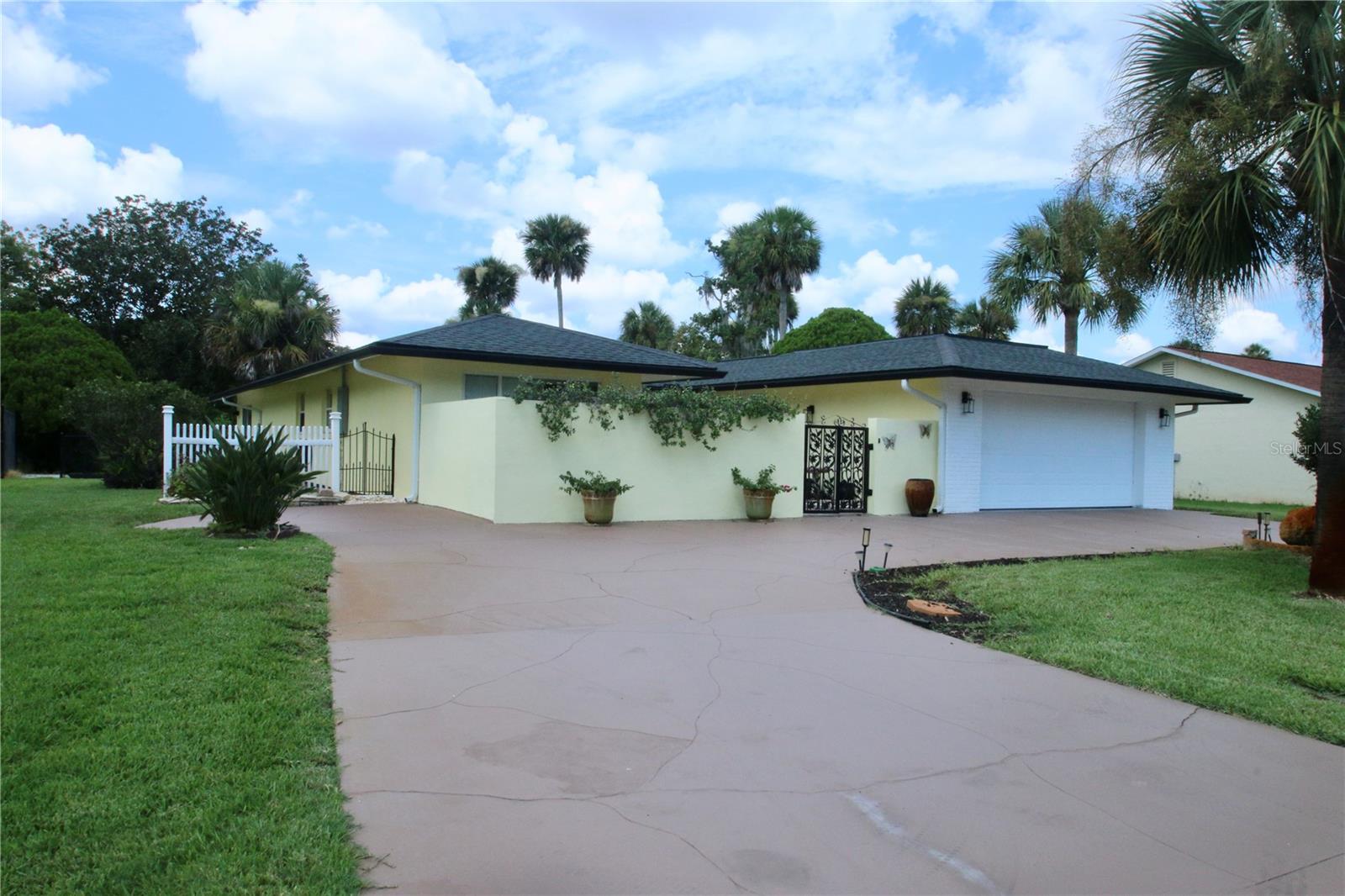 Rarely do houses like this come up for sale to own a stylish home backing up to the 13th tee of Palm Harbor Golf Club. Enter through custom wrought iron gates into a spacious courtyard—perfect for morning coffee. Inside, floor-to-ceiling windows and skylights offer stunning 180° views of the course and old oaks with water view.
Built by Levitt/ITT, this is a 1900 sq foot 2-bed, 2-bath home which blends vintage charm with modern updates. Highlights include:
Open floor plan with white tile and laminate floors, remodeled bathrooms with double vanities, stylish gray-and-white kitchen cabinets, ample closets and storage. Large lot with mature landscaping, oversized double garage with electric hurricane rated garage doors (110)
No HOA.
Close to European Village, Intracoastal Waterway, trails, shops, dining, and medical care.
This is a prime Palm Coast location!
Roof (11/2022) with oversized seamless gutters
Water heater (2022)
AC (4/2022)
Electric Panel 6/2025
4 zone irrigation system
Pavers that surround the house