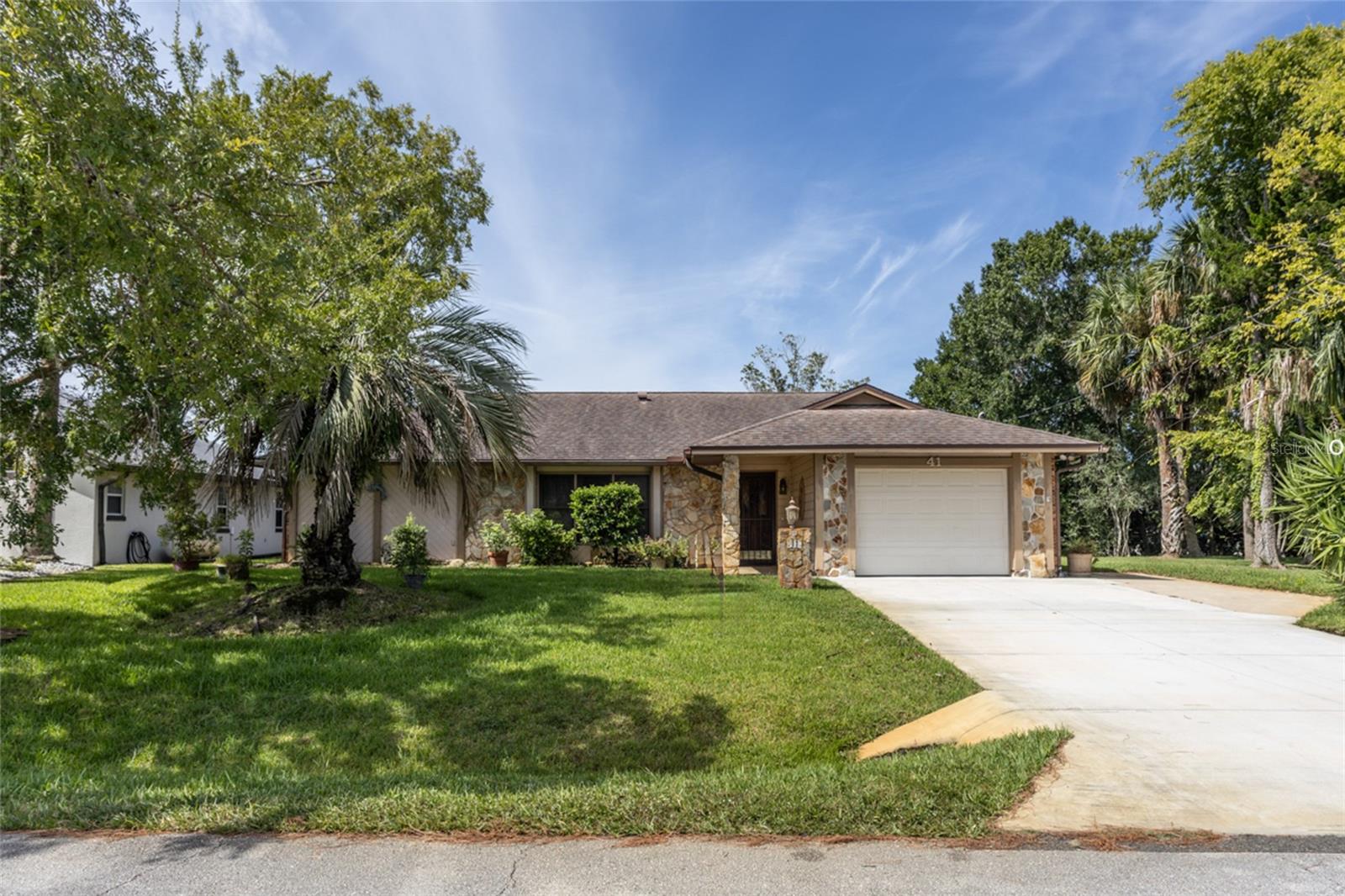 One or more photo(s) has been virtually staged. Experience the lifestyle of canal-front living in this beautifully maintained pool home. Enjoy expansive water views, complete with a sparkling pool and a tranquil coquina rock waterfall. With 70 feet of frontage and a spacious 10' x 20' dock, it’s the perfect place to relax and take in the serenity of the water views.
Inside, a 17' x 18' family room overlooks the canal, featuring a wall of windows that flood the space with natural light—ideal for entertaining or gathering with family. The living and dining rooms add comfort and versatility, while the primary suite offers an en suite bath designed to be handicap accessible.
Recent updates include a widened driveway (16’ across for extra parking, 2021), new HVAC (2023), roof (2017), and updated dock wood (2012). With inviting stone accents, this home offers excellent curb appeal and a welcoming presence.
Schedule your private tour today!