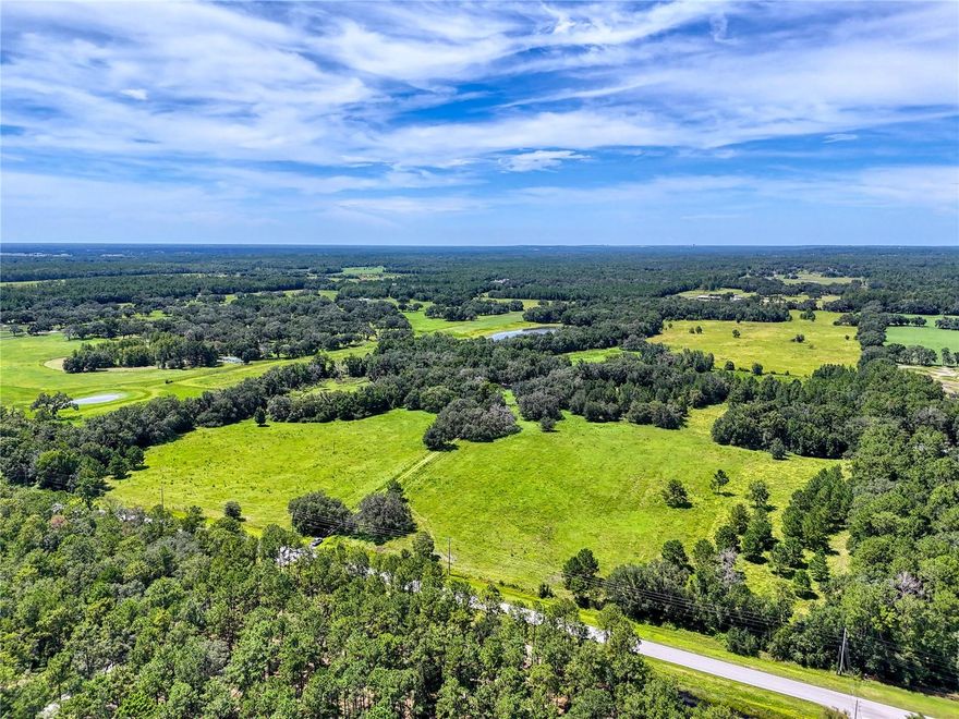 135-Acre (MOL) Estate in Central Florida – Rolling Hills, Grandfather Oaks & Boundless Potential!

Discover a rare opportunity to own 135 stunning acres in the heart of Central Florida. Nestled among gently rolling hills and framed by majestic grandfather oaks, this expansive estate borders scenic Squirrel Prairie Lake and offers the perfect balance of natural beauty, privacy, and versatile use.

Whether you're dreaming of building your forever home, developing an equestrian estate, investing in future development projects, or continuing its use as a productive working farm, this property caters to a wide range of visions.

Highlights include:

Over 100 acres of high, dry, buildable land with panoramic views and multiple homesite options.
Rolling pastures, mature oak hammocks, and serene natural water sources.
Two existing homesites, each with its own septic system, well, and electrical meter.
Established fencing and cross-fencing, ideal for livestock or equestrian use.
Zoning suitable for low-density residential or equestrian development.
Enjoy the peace and privacy of a rural setting without sacrificing convenience. The property is centrally located with quick access to major highways, making it just under an hour to Tampa and convenient to Orlando. You're also minutes from charming small towns, local markets, and recreational destinations throughout the region.

Whether you envision a private retreat beneath the oaks, a boutique residential community, or a continuation of its agricultural legacy, this 135-acre estate is a rare blank canvas ready for your unique vision.
