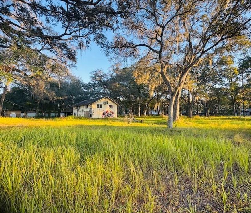 Prime Commercial Development Opportunity located on the corner of Broad Street and Nicholas Ave, Brooksville, FL.  Exceptional opportunity to acquire a 1+ acre corner commercial parcel with high-visibility highway frontage on Broad Street in Brooksville, Florida. This property offers strong potential for a Planned Unit Development (PUD) or professional office complex, making it ideal for investors, developers, or owner-users seeking a strategic commercial location. The site has electric available on-site and an existing well, with a septic system needed.  The property includes a vacant building that can be determined whether it is salvageable or a tear down and lean-to that can either be repaired or a tear down as well.  It can provide a foundation for redevelopment or repurposing. With its generous acreage and prominent corner positioning, the property can be transformed into a profitable commercial enterprise tailored to professional or business use.   An adjacent parcel is also available for purchase, offering a unique dual-use opportunity. The additional parcel is zoned R1A Residential, allowing a buyer to build a residence alongside the commercial development—ideal for owner-operators who want to live nearby while overseeing their investment.  Both properties are located directly across the highway from Hernando County Airport, adding to the site’s visibility, accessibility, and long-term growth potential. The owner is highly motivated and willing to consider a creative or bundled purchase options for a buyer with vision.  Prime location. Exceptional value. Endless potential. Develop your business, expand your portfolio, and create a future-focused investment in one of Brooksville’s growths to a promising commercial corridor. Please DO NOT ENTER THE BUILDING! ROOF IS COMING DOWN AND FLOORS ARE UNSTABLE!  Additional Parcel Available please refer to MLS# G5105778