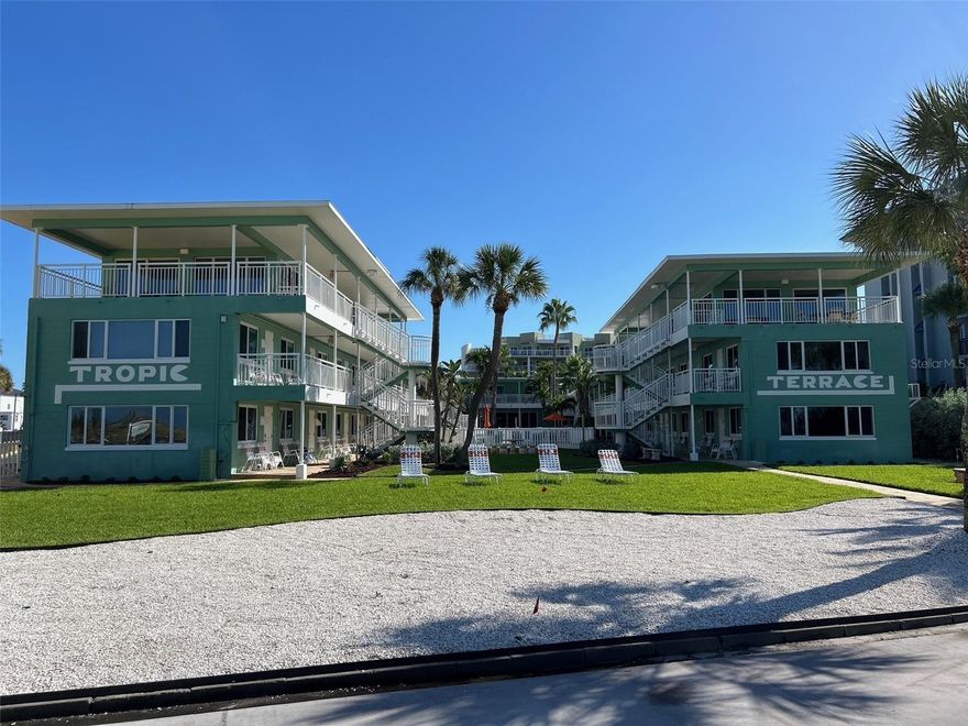 Beautifully remodeled beachside studio in a desirable condo hotel co-op on Treasure Island.  New electrical and plumbing. This unfurnished unit is located directly in front of the pool, just a short walk to the beach, and offers convenient breezeway access to the parking lot.  Positioned on the Treasure Island Boardwalk, it provides easy access to beachside bars, restaurants, and entertainment, and is only a short walk to John's Pass Village & Boardwalk.  Perfect for walking and biking, this versatile property has been used as both a seasonal rental and a work-from-paradise winter escape, making it an excellent opportunity for investors or those seeking a personal beaach retreat.