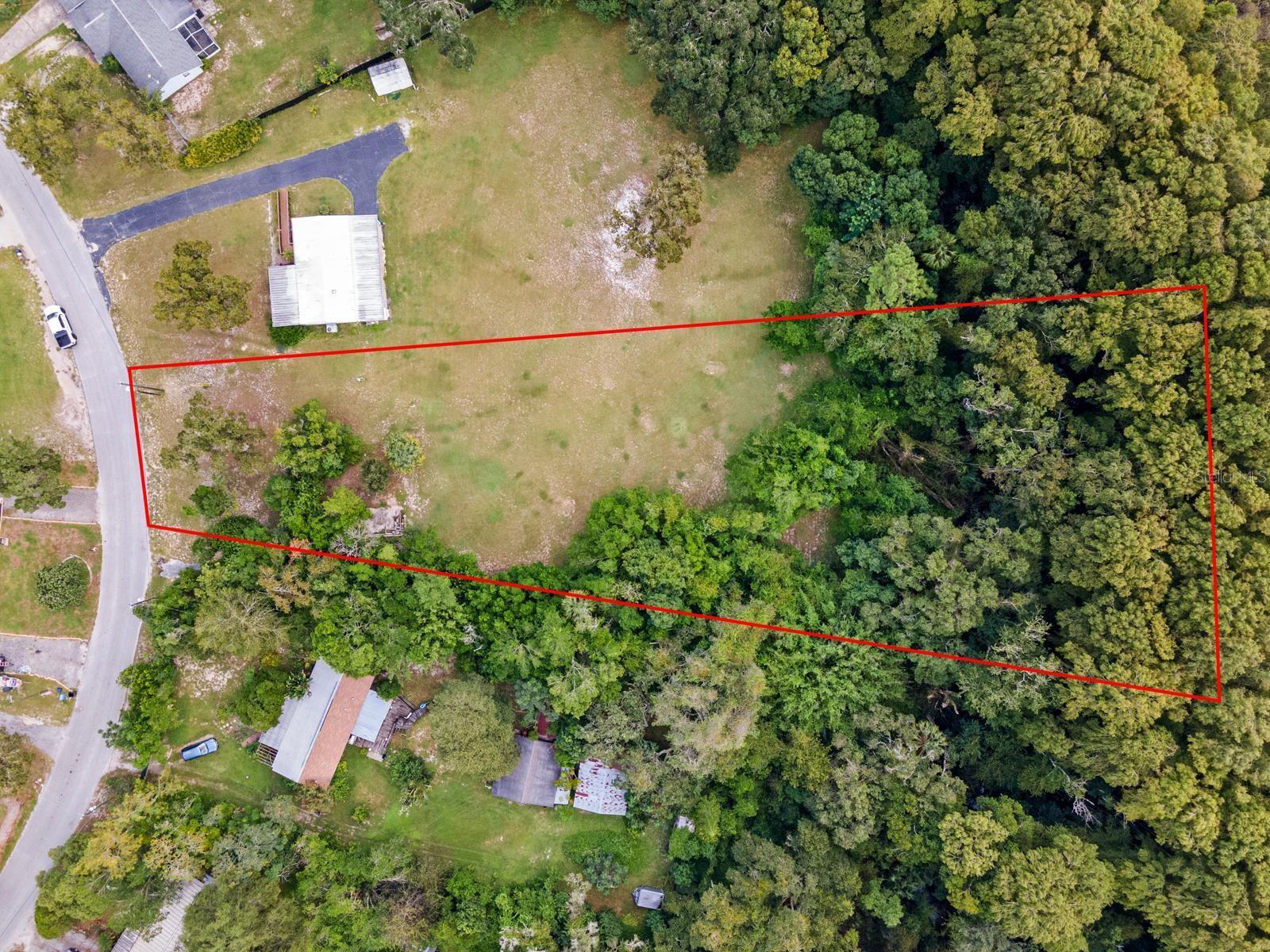 Prime Buildable Lot with Utilities in Place – AR Zoning!
This versatile, buildable lot is perfect for a block or mobile home, offering a rare combination of convenience and flexibility. Previously hosting a mobile home, the property already has septic, well, and electricity available (current condition of septic and well is unknown). The Agricultural Residential (AR) zoning allows for a wide range of possibilities, giving you the freedom to create your ideal living space.
The lot is mostly cleared, potentially saving you time and expense with site preparation, and its gentle terrain may minimize the need for fill. Mature trees along the property lines provide natural privacy and a serene setting. With quick access to Ridge Road, Little Road, and State Road 52, this location offers the best of both worlds—peaceful rural living with convenient access to major thoroughfares.
Don’t miss out on this opportunity to bring your vision to life!