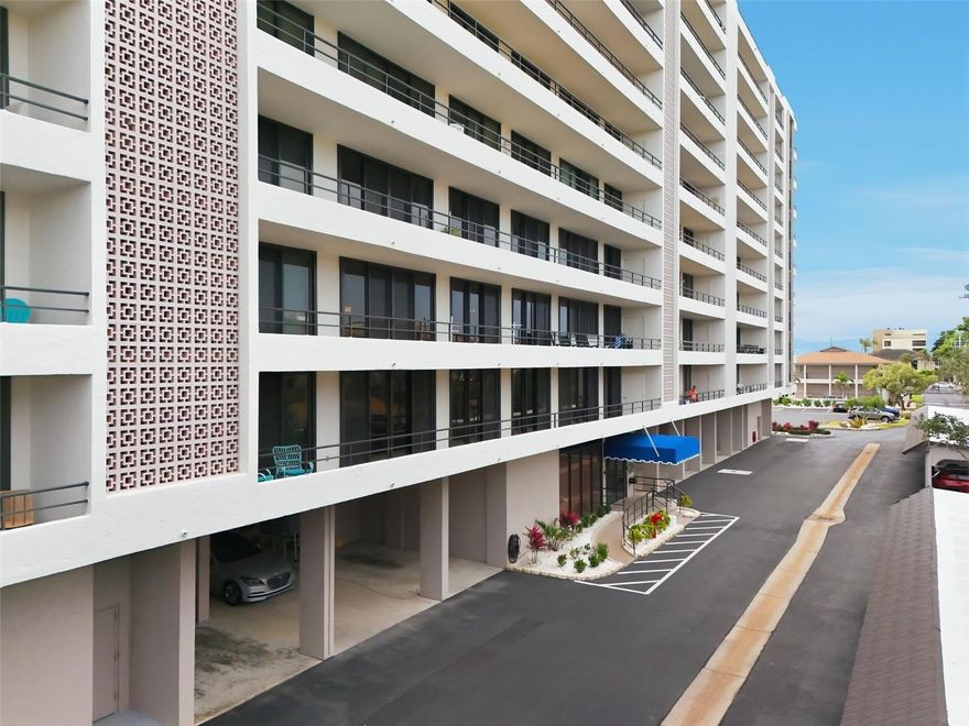 Deeded beach access, Intracoastal waterway frontage with boat dockage AND room for the whole family! Discover the epitome of coastal living in this fabulous three-bedroom, two-and-a-half-bath residence, boasting 2,358 square feet of interior space and a 95-foot balcony spanning the entire length of the home. Recently upgraded with $80,000 worth of high-impact hurricane sliders, the spacious floor plan offers multiple living and dining areas, with a split layout ensuring privacy. This is a real gem for investors as it is one of only eight 3-bedroom units in the building. At the Anchorage, owners and renters enjoy deeded, gated beach access right across the street, a canal with boat dockage and kayak/paddleboard launch, and beautiful sprawling park-like grounds overlooking the intracoastal waterway. Other amenities include a gated entrance, heated pool, fitness center, clubhouse, tennis and pickleball courts, shuffleboard courts and kayak racks. Onsite rental management and a one-week minimum rental make this community very popular with vacationers and savvy investors alike. Come see why The Anchorage is the place to be year-round on Siesta Key.