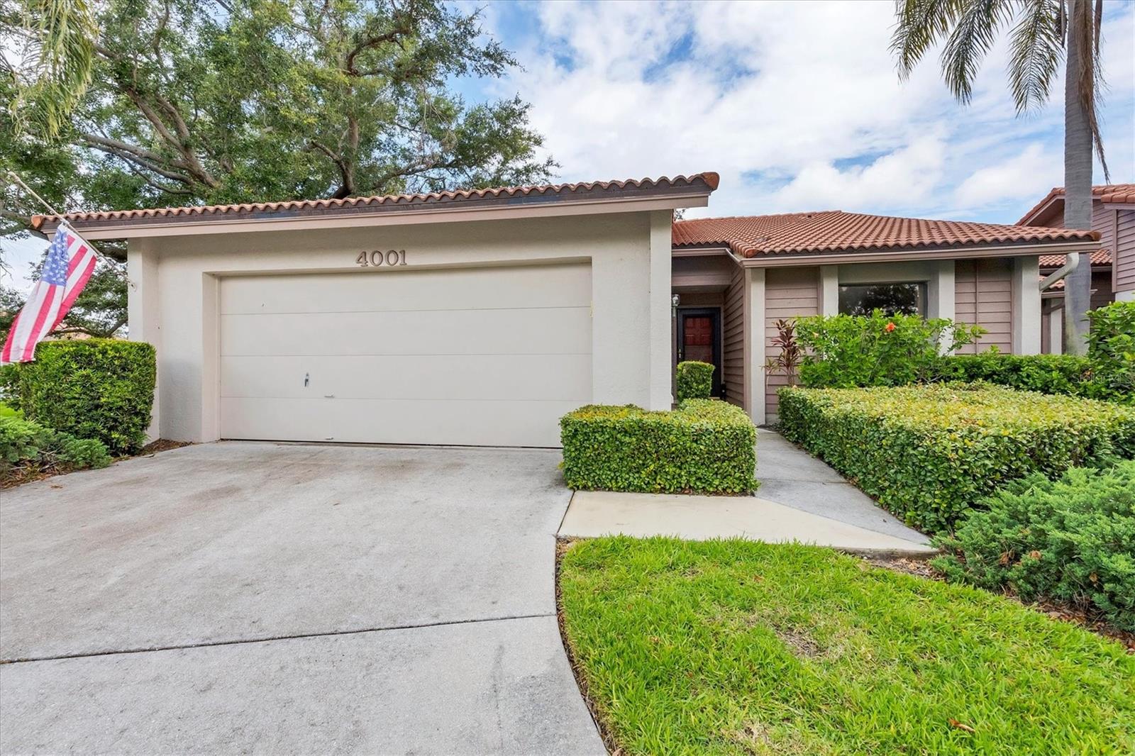 Rarely Available Corner Lot in Lakeshore Village South with HUGE upside. Welcome to Lakeshore Village South, a quiet, walkable, and well-kept community and one of Sarasota’s most desirable neighborhoods. This rarely available corner lot unit is brimming with potential, the perfect canvas for your personal vision, style, and creativity. Offering 2 spacious bedrooms, 2 full bathrooms, and a large versatile den/office, this condo provides a smart, split floor plan that offers privacy and comfort for both you and your guests. Soaring ceilings and abundant natural light create an airy, inviting atmosphere, while the serene lake view serves as a stunning backdrop from your screened lanai, perfect for morning coffee or evening relaxation. The expansive primary suite features generous closet space and a well-appointed en-suite bath. Enjoy both formal dining and a cozy breakfast nook just off the kitchen, making everyday living and entertaining a breeze. Additional highlights include an oversized garage with epoxy floors, low HOA fees, and access to top-tier community amenities: tennis courts, brand new pickleball courts, a community pool, and a clubhouse. Located just minutes from the world-renowned white sands of Siesta Key Beach, as well as Sarasota’s vibrant downtown, fine dining, shopping, and nightlife, this home offers both tranquility and convenience. Don’t miss this opportunity to make one of Sarasota’s hidden gems your own.