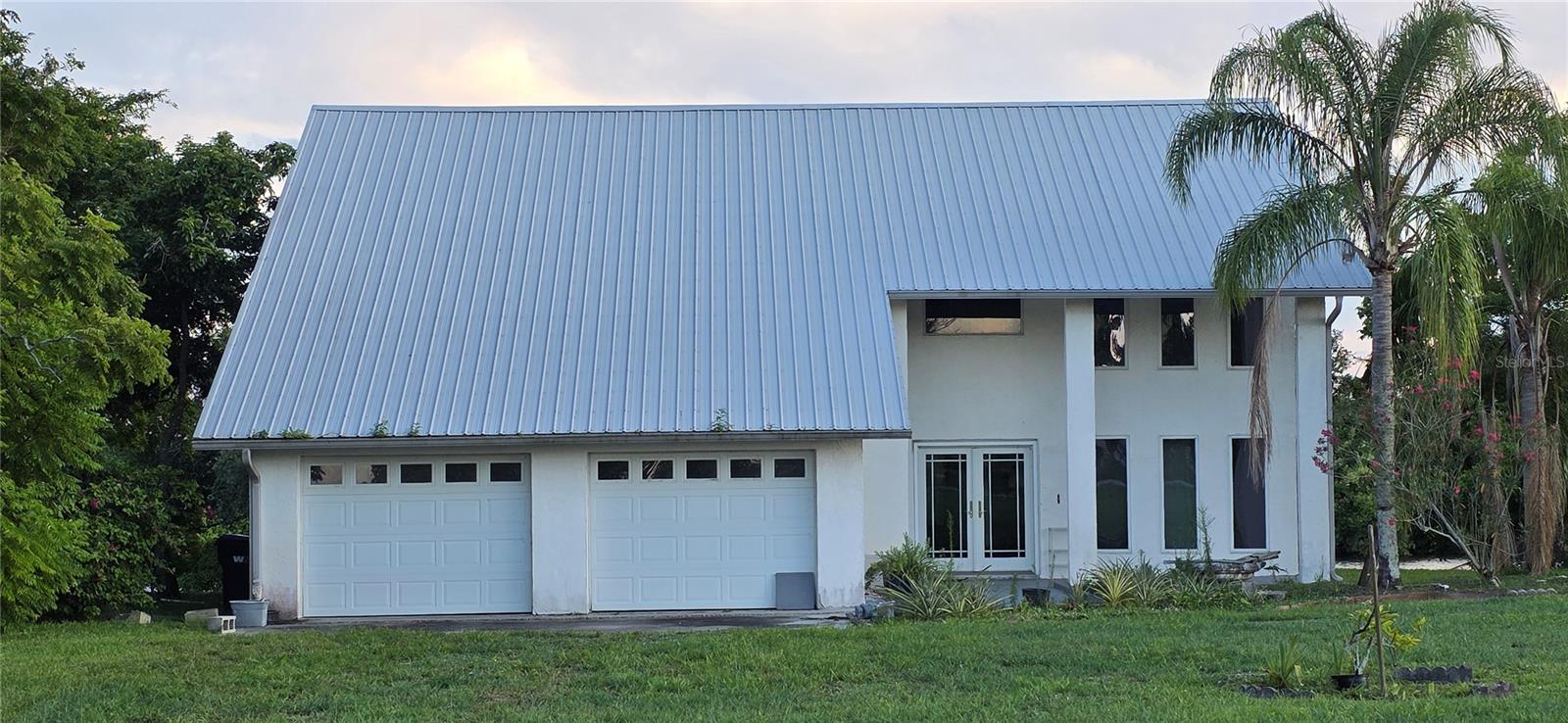 Waterfront: Enjoy peaceful waterfront living in this concrete block home. Insulated Anderson windows.
2021 air conditioners, 2017 26 ga metal roof.
Lake access and River views from multiple rooms of the home. Spacious 3 bedroom, 2.5 Bathrooms offers comfort, style, and quality construction throughout.
With High ceilings and large open rooms, Is perfect for entertaining or relaxing.
The Primary suit features serene water views and access to the balcony.
Bedroom #2 also has water views and access to the balcony.
Plush carpet and ceramic tile throughout.