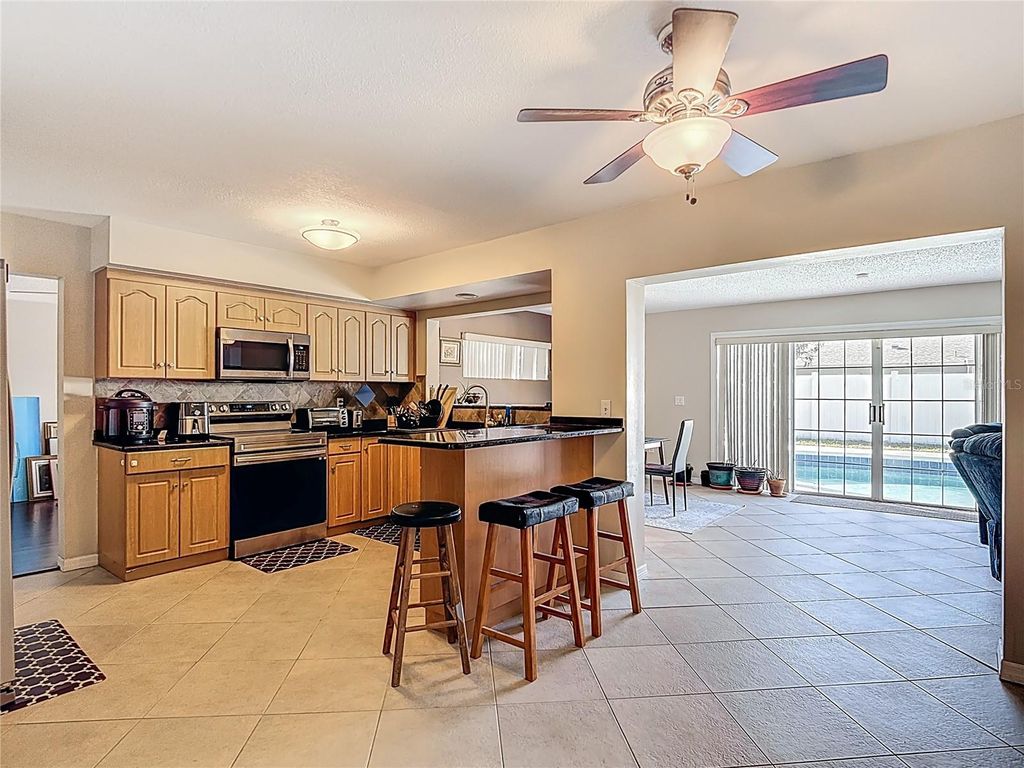 Photo of 3114 W Paris Street, Tampa, FL 33614 (MLS # O6391925)