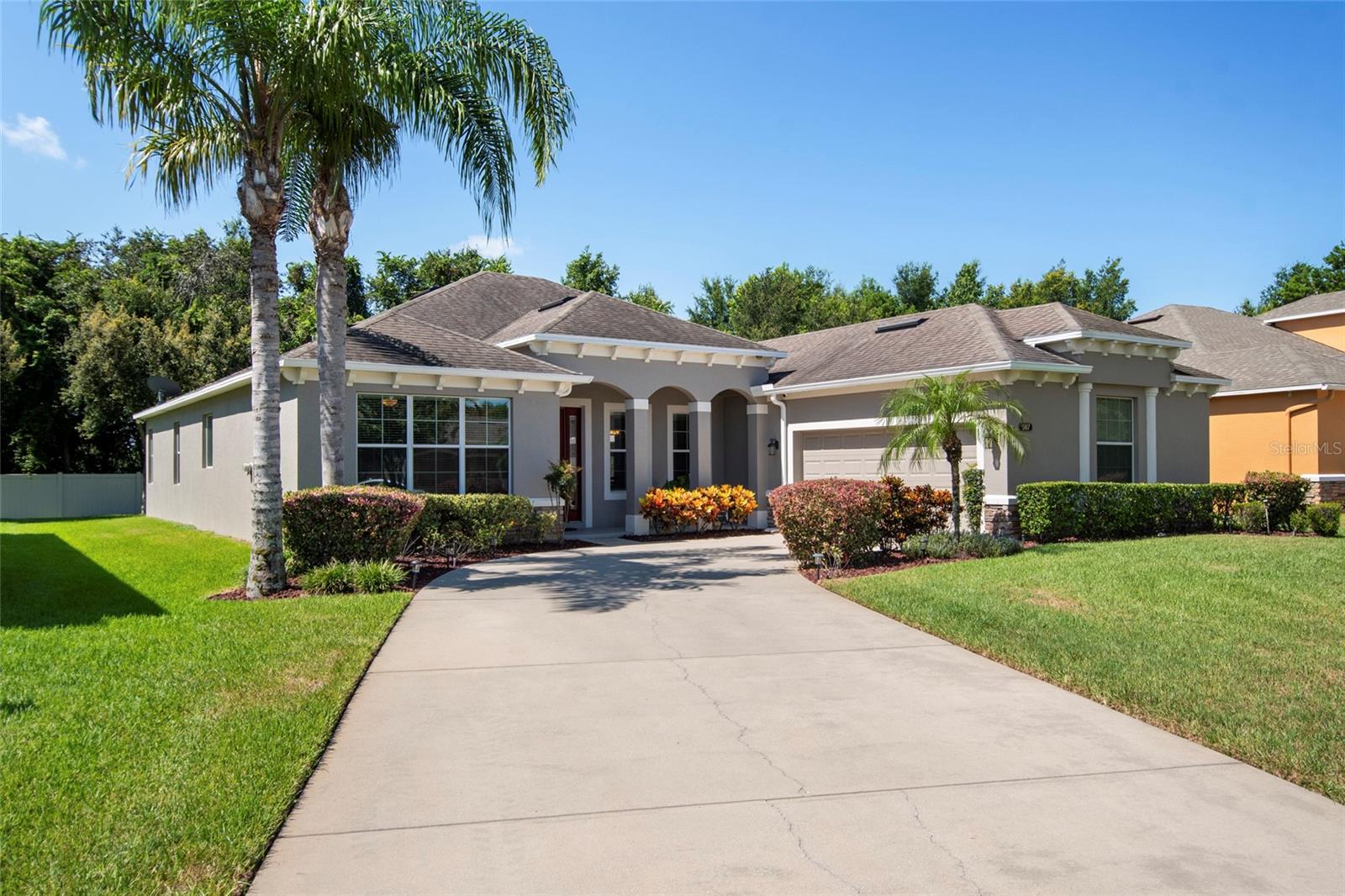 Welcome Home to McCormick Woods! This well maintained 4 bedroom 3 bath MI home was built in 2014 with many upgrades. Nestled on a Cul de Sac this home has over 2700 sq ft of living area. You are welcomed into a spacious foyer that leads you into the open floor plan. The thoughtfully designed layout features a generous great room, separate dining area, and a bonus space ideal for a home office, den or playroom. Tile and Luxury Vinyl floors flow throughout the spacious living areas, creating an inviting and timeless ambiance. The kitchen is a chef’s dream! Featuring an expansive island, granite countertops, 42” white cabinetry, new stainless-steel range, dishwasher and microwave. Entertaining is a breeze with ample counter seating and a large breakfast nook. The primary suite includes a full en-suite bath, dual sinks, soaking tub, separate shower and walk in closet. Three additional bedrooms provide plenty of space for family, guests, or flexible use. Both full bathrooms are well-appointed with clean finishes and ample storage. Large sliding glass doors lead you to a screened lanai overlooking the tranquil private backyard perfect for relaxing after a long day. Additional features include an indoor laundry room with a free-standing utility sink, front loading washer and dryer, 2 car garage equipped with storage racks and attic access. Google security system and Termite Bond that is transferable. Exterior was painted in 2023, New HVAC system including outside heat pump and air handler in 2021, still under warranty. Located in a well-established gated neighborhood, community pool, playground and basketball/pickleball court with convenient access to shopping, dining, and major highways. This home offers an unbeatable combination of comfort, convenience, and community. Call to schedule a private tour today!
