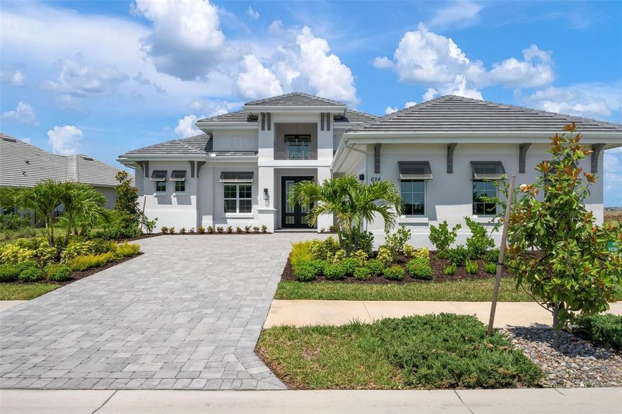 Recently staged and completed Madison 2 by Stock Luxury Homes with expansive lake views, why wait for the builder, when you can move in now? Experience the pinnacle of elegance in this modern luxury home, where breathtaking lake views and superior craftsmanship converge. Designed for those who value sophistication, this property offers a harmonious blend of timeless style with state-of-the-art functionality. Spectacular lake views frame the serene beauty of the lake, drawing natural light and picturesque views into almost every room. Equipped with premium Jenn Air appliances, sleek countertops, and custom cabinetry, this kitchen is a culinary dream. Master suite includes two ample walk-in closets with wood shelving, expansive views of the pool and lake beyond, and the master bath will wash you in luxury with its large roam-in shower, free standing tub, and clean crisp finishes. Contemporary finishes, high ceilings, and an open floor plan create a light and airy ambiance which is perfect or both relaxation and entertaining. Seamless access to the expansive pool area will enhance your connection to nature while providing the ideal setting for hosting gatherings or enjoying quiet moments. Located in the emerging Wild Blue community, recreation facilities include tennis courts, a fitness center, and fishing access along with miles of sidewalks. Schedule your private tour today and discover this perfect blend of tranquility and modern living.