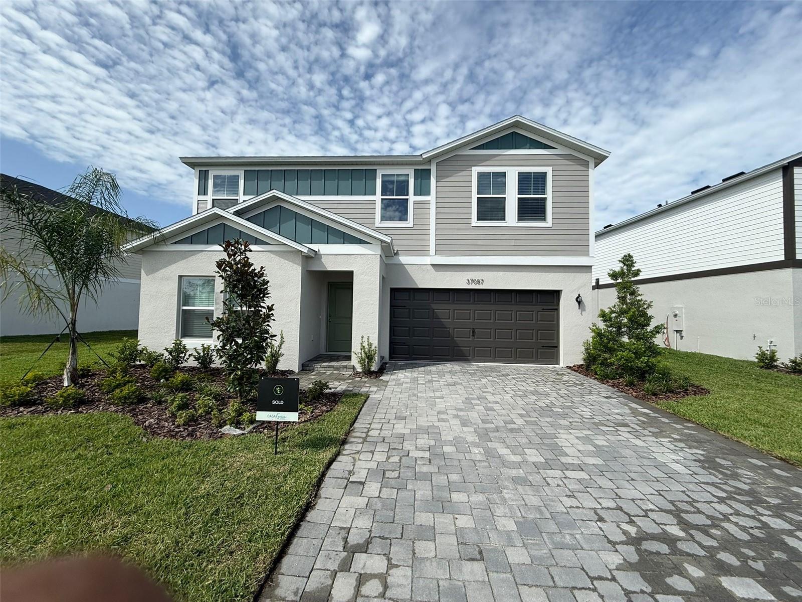 One or more photo(s) has been virtually staged. Modern 5-Bedroom Home in the Desirable Two Rivers Community Discover this spacious 2420 sq ft, 5-bedroom, 3-bath home, perfectly situated in the sought-after Two Rivers community with gorgeous pond views on a oversized lot. Located just off SR 56 and Morris Bridge Road, this residence offers unparalleled convenience near top-rated schools, shopping, dining, and entertainment options. Interior Highlights: Open-concept main living area flooded with natural light and featuring sleek luxury vinyl plank flooring. Gourmet kitchen equipped with quartz countertops, new stainless steel appliances, and ample cabinet space—ideal for both cooking and entertaining. Private bedroom and full bath off the foyer, providing a quiet retreat for guests or family members. Upstairs owner's suite offering a spa-like experience with a walk-in shower, double vanity, and walk-in closet. Three additional spacious bedrooms, a second full bathroom, and a conveniently located upstairs laundry room with a new washer and dryer. Modern Amenities: Smart thermostat with voice control for enhanced comfort. Professionally designed landscaping that complements the home's contemporary elevation. Spacious 2-car garage providing ample storage space. Prime Location: Situated just minutes from premier shopping, dining, and entertainment hotspots such as The Shops at Wiregrass and The Grove at Wesley Chapel. Enjoy proximity to the Epperson and Mirada lagoons, offering unique recreational experiences. With easy access to downtown Tampa and Tampa International Airport, this home provides the perfect blend of peaceful living and metropolitan convenience.communities!