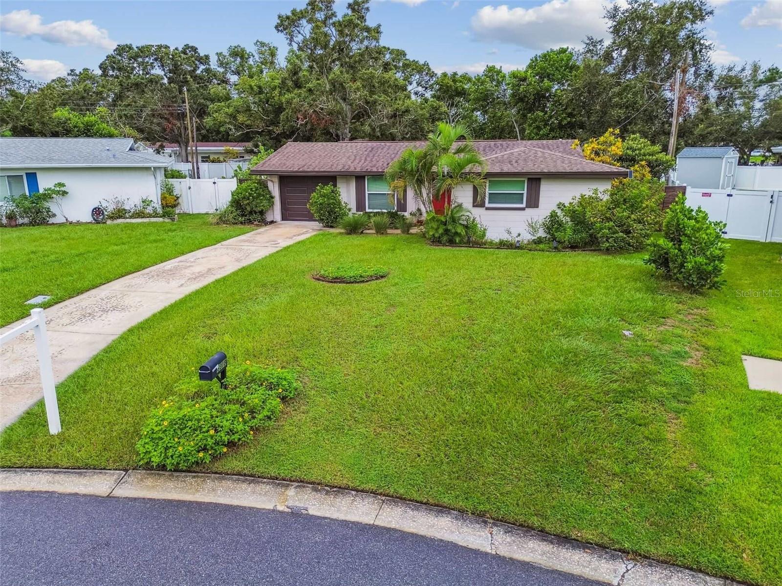 One or more photo(s) has been virtually staged. Located in one of the highest points of Seminole and just steps from the Pinellas Trail, this beautifully maintained home sits on an extra-large lot with a sparkling private pool. Imagine living only seven minutes from Indian Shores Beach while enjoying peace of mind knowing you are high and dry with no flood insurance required. The property is zoned for top-rated schools and is situated in unincorporated Seminole, making it easier to secure permits for short-term rentals or an accessory dwelling unit (ADU), an ideal option for such a spacious lot.
Inside, the home showcases impeccable luxury laminate floors, new texturing and interior paint throughout, and hurricane-impact windows and doors—including an insulated garage door—for year-round comfort and efficiency. The open floor plan offers three bedrooms and two bathrooms, with a family and dining area that opens to the lush, filled with Florida native plants, fenced-in backyard. Lounge by the pool, entertain on the patio, or hop onto the Pinellas Trail for outdoor recreation any day of the week.
Smart upgrades include a high-efficiency hybrid heat pump water heater (2023), Bosch dishwasher (2023), impact windows (2023), and a new flat roof (2025), with HVAC serviced yearly (2017), a Smart Thermostat (2024) and more. This home combines location, resilience, and lifestyle - ready for you to move in and create your own Florida oasis.