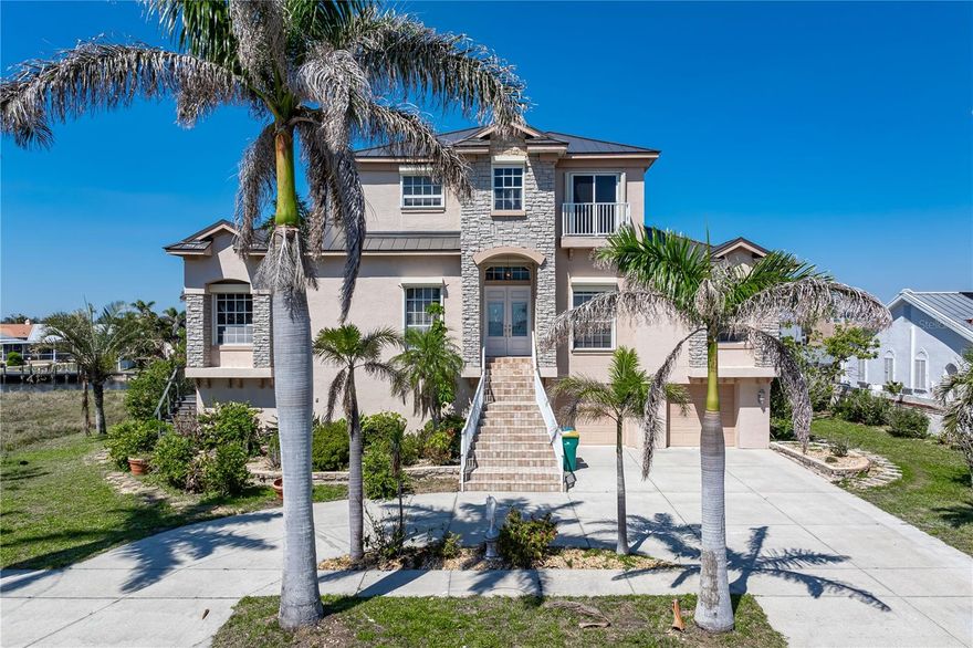 EXCEPTIONAL WATERFRONT HOME IN PORT CHARLOTTE W/NEARLY INSTANT ACCESS TO OPEN WATER! Looking for a spectacular waterfront residence w/***NEW METAL ROOF***, FIVE BEDROOMS (ALL OF THEM W/EN-SUITE BATHS), A PRIVATE DEN & OVER 4,100 SQFT of living space? Run, don't walk to this one-of-kind, two story home that was designed for entertaining. The first floor boasts a formal living room w/wet bar, formal dining room, home office plus a LARGE kitchen & spacious family room w/fireplace. The living room, family room & two guest rooms open to the balcony area that overlooks the pool. True chef's kitchen offers an abundance of cabinet & counter space w/a center island & prep area, stainless steel appliances (w/two dishwashers), plus an oversized walk-in pantry. The adjacent breakfast nook offers direct access to the balcony w/views of the pool & canal beyond. Three bedrooms are found on the main floor - each w/a large, walk-in closet & private en-suite bath. The master bedroom, laundry room & 5th bedroom are located on the second floor. The master suite features awesome views of Charlotte Harbor, a bump-out seating area & two unexpectedly large walk-in closets. The master bath has dual sinks atop a floating vanity w/stone counter plus a jetted garden tub & separate walk-in closet. The private WC has two linen closets. There is no shortage of storage space here! The 5th bedroom has (of course) an en-suite bath PLUS a balcony overlooking the canal view behind the home. The two-story pool cage encompasses the ground floor level area plus the balcony off the main floor. From the ground level, you'll enjoy the in-ground pool that is surrounded by a brick paver deck plus a summer kitchen, half bath & ample covered space that is perfect for a ping pong or foosball table, dedicated workshop area. The space has been used to host large parties w/catered food & tables filling the space w/laughter & conversation. Picture hosting memorable family gatherings here! An oversized, composite dock is located just steps from the back door. Keep your boat in your backyard & start enjoying some of the best fishing & boating in SW Florida immediately! You could swim to open water from the dock! Best of both worlds w/harbor views available from the front of the home & protected canal/dock for your boat at the back of the home. Other amenities include two A/C systems, hurricane protection, large coat/shoe closet at the foyer & an oversized two-car garage w/split doors. For the gardening enthusiasts, this house has an abundance of Mango, Fig, Chikoo, Lychee, Sugar Apple trees and more! Make an appointment today, you won't be disappointed.