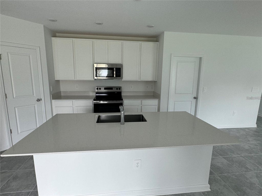 Photo of 2166 Aquifer Lane, Davenport, FL 33837 (MLS # O6451448)