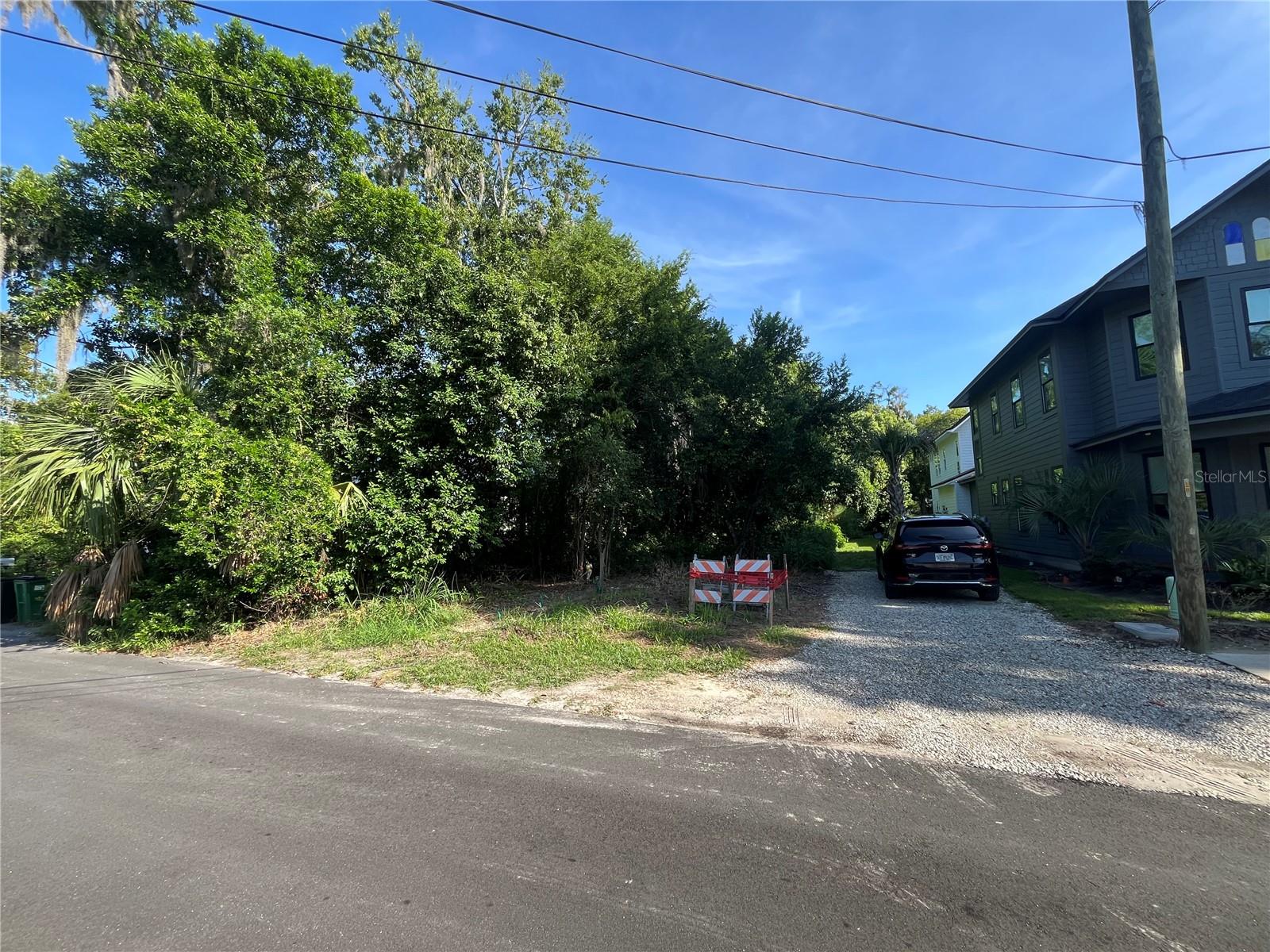 Fantastic location for new construction. Walkable to Grove Street amenities, farmers market, bike trail. Adjacent new construction comps sold for $300-325 SF. U3 zoning allows for duplex construction or single family with an ADU. Utilities are installed, paid for, and on site from GRU. Historic design, builders drawings, are available and completed for a Spanish Revival Style Home with detached ADU.