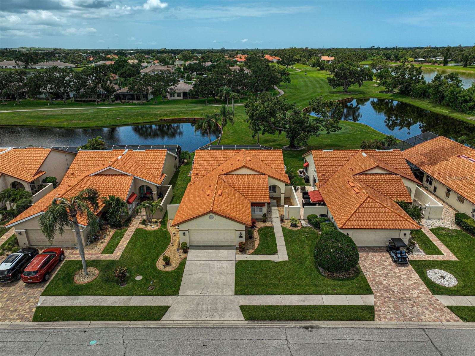 Discover this well-maintained 3BR/2BA Patio home with a private pool, located in the established community of Peridia Golf & Country Club. The enclosed lanai features a newly replaced aluminum structure and screening as of 2025. The thoughtfully designed layout of this home showcases scenic views of the golf course and two lakes, creating a tranquil and private setting. The kitchen features KraftMaid wood cabinets with soft-close doors, granite countertops, an oversized island for prep and serving, a built-in desk, and a dedicated eat-in dining area- perfect for casual meals and entertaining alike. A double oven adds functionality for holiday hosting or everyday convenience. The laundry area has been relocated to the garage to allow for additional storage inside the home. The spacious primary bedroom includes a large walk-in closet and ensuite bath with a walk-in shower accented by glass block for natural light, along with dual vanities. The living and dining areas boast vaulted ceilings and open directly to the lanai and pool- ideal for seamless indoor-outdoor Florida living. HVAC system was replaced in 2020; tile roof in 2011. Peridia Golf & Country Club offers an 18-hole executive golf course, community pool, tennis and pickleball courts, a Tiki bar, and a clubhouse with dining. Live music is scheduled on Friday evenings in the dining room and Sunday afternoons at the outdoor tiki bar. Residents have access to various activities including member-only events, book clubs, bowling leagues, water aerobics, and card games. Short drive to UTC Mall, Sarasota & Tampa airports, top hospitals, restaurants, museums, and Florida’s Best beaches! See It for Yourself – Book a Showing Now! $100 Application Fee; $337 Quarterly Yard Care; $450 Annual food/beverage Minimum; $877 Quarterly Master Association; $4,000 One Time Capital Reserve.