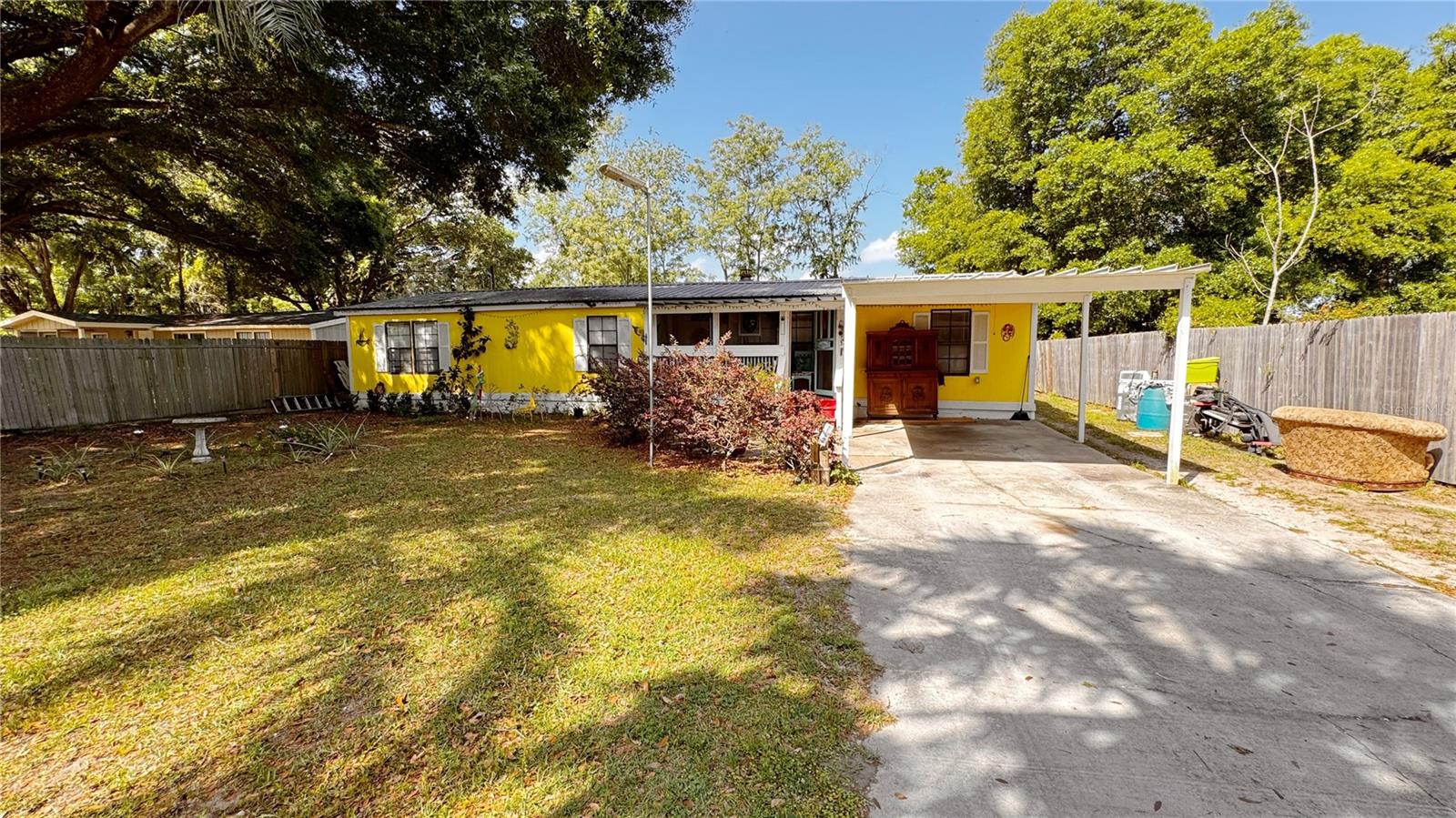 Experience Peaceful Country Living Near Lake Weir!
Welcome to this spacious and inviting 3-bedroom, 2-bathroom home nestled in a serene, nature-rich setting just moments from Lake Weir. Whether you’re seeking a primary residence, vacation getaway, or investment opportunity, this charming property offers the perfect blend of comfort, space, and versatility—with no HOA!
Step inside to find a cozy living room highlighted by a beautiful fireplace and French doors that flood the space with natural light. The enclosed back porch adds approximately 300 sq ft of additional living space, ideal for a cozy sitting area or sunroom. A screened-in front porch offers the perfect spot to enjoy your morning coffee while taking in the peaceful surroundings.
Additional features include:
• Two sheds: One approximately 22x13 ft, plus a 10x10 ft shed attached to the house for extra storage or workspace
• 12x12 ft hobby room conveniently located next to the enclosed porch—perfect for crafts, a home office, or a workout space
Outdoor enthusiasts will love the close proximity to Lake Weir and the Ocala National Forest, offering endless opportunities for boating, fishing, canoeing, kayaking, hiking, equestrian trails, and wildlife viewing. Adventure seekers will also enjoy over 200 miles of trails for ATVs, motorcycles, and 4WD vehicles in the national forest.
Just a 6-mile drive to Eaton’s Beach, where you’ll find public lake access, swimming, and lakeside dining at Eaton’s Beach Bar and Grill. You’re also within walking distance to the world-famous Gator Joe’s Restaurant—a local favorite for waterfront dining and live entertainment.
Only 15 minutes to The Villages, offering even more shopping, dining, and entertainment options as well as places like the nearby Orange Blossom Opry, a state-of-the-art live music venue bringing top-tier performances to the area.
Don’t miss your chance to own a slice of paradise with modern comfort, rural charm, and unbeatable access to Central Florida’s best natural and cultural attractions.