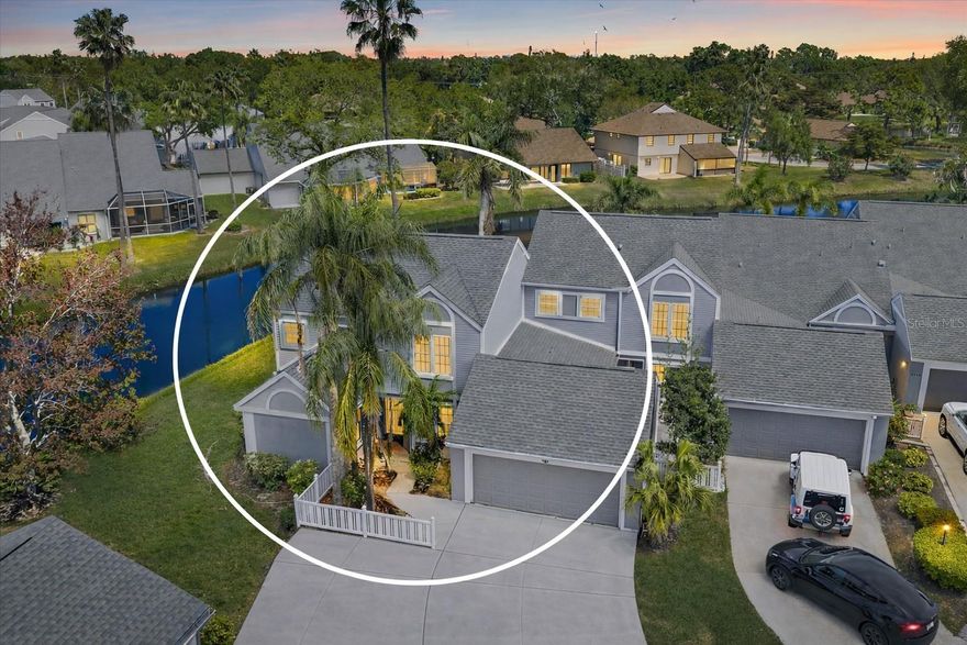 One or more photo(s) has been virtually staged. LIVE ON VACATION NOW IN one of the largest condos in Southwinds at Five Lakes, offering exceptional space and a flexible layout ready for you to make your own. This expansive 3-bedroom, 3-bath residence PLUS LOFT is thoughtfully designed for both comfortable living and effortless entertaining. VAULTED CEILINGS and HURRICANE IMPACT WINDOWS fill the home with natural light, while the oversized living and dining areas create a seamless, open flow.

A PRIVATE GUEST SUITE provides ideal separation for visitors, while tranquil POND VIEWS create a peaceful setting. With generous square footage throughout, there is ample opportunity to personalize and truly make this home your own. Enjoy the ease of MAINTENANCE-FREE living, with ADDITIONAL PARKING available for added convenience.

Southwinds at Five Lakes offers beautifully maintained grounds and a well-appointed amenity package, including a community pool, clubhouse, pickleball, and tennis courts. The location is exceptional—just a short 8-mile drive to Anna Maria Island, allowing you to enjoy the Gulf beaches with ease, while also being close to University Town Center, known for its world-class dining and shopping, and minutes from IMG Academy.

The maintenance fee provides outstanding value, covering cable, internet, exterior building maintenance, pool and common grounds care, lawn service, irrigation, pest control, and roofing. Residents also enjoy resort-style amenities featuring two sparkling pools along with pickleball and tennis courts, shuffleboard, and convenient RV or boat trailer parking available for a nominal fee.

Take advantage of this rare opportunity to own a spacious, well-located condo in one of the area’s most desirable communities. What are you waiting for? Life is not a dress rehearsal, LIVE ON VACATION NOW!