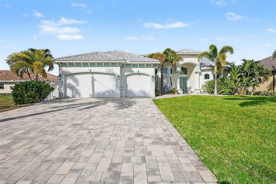 Experience premier Gulf-access living in Northwest Cape Coral, where direct boating access, wide water views, and refined design come together in a property built for both lifestyle and opportunity. With no bridges to the Gulf and a tranquil lake backdrop, this residence offers rare flexibility for investors, seasonal owners, or full-time waterfront living.

Constructed in 2018, the home features 3 bedrooms plus a den, 3 full baths, and 2,526 square feet of thoughtfully arranged living space. A split-bedroom floor plan ensures privacy for owners and guests alike, making it ideal for extended stays or rental use. Upon entering, expansive water views immediately capture attention, complemented by coffered and tray ceilings, French doors, custom cabinetry, and a soft coastal color palette that creates an atmosphere of understated elegance.

The open-concept kitchen is designed to support both entertaining and everyday living. A large center island anchors the space, while double ovens, a wine cooler, reverse osmosis system, and abundant cabinetry provide both functionality and style. The kitchen flows seamlessly into the main living and dining areas, keeping the water view as the natural focal point. A wet bar and spacious gathering areas enhance the home’s entertainment appeal.

The primary suite offers a private retreat with direct lanai access and peaceful water views. The spa-inspired bath features dual vanities, a soaking tub, and a multi-head walk-in shower. Guest bedrooms are generously sized, and the flexible den allows for use as a home office, additional sleeping space, or media room.

Outdoor living defines the experience. The expansive screened lanai creates a private resort setting complete with a heated saltwater pool and integrated spa, both enhanced by a reverse osmosis system. An outdoor kitchen, covered seating areas, and the serene lake setting provide the perfect environment for hosting or relaxing after a day on the water.

Additional highlights include impact-resistant windows and doors, concrete block construction, a tile roof, a 3-car garage, paver driveway, and strong curb appeal. With no HOA restrictions and direct access to open water, this property is positioned for continued rental success or personal enjoyment.

Conveniently located near shopping, dining, and major corridors, this home delivers boating convenience, privacy, and enduring value in one exceptional Northwest Cape Coral waterfront setting.