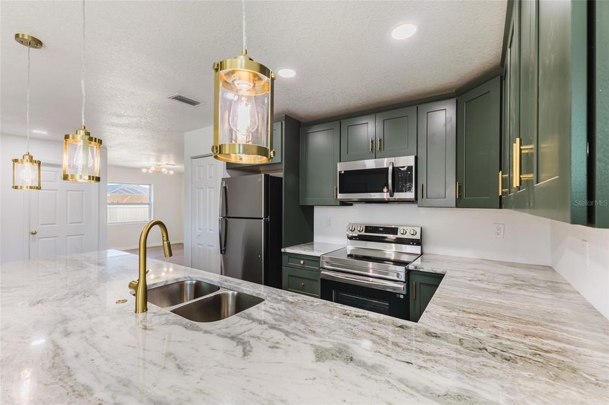 Welcome to 6254 Spinnaker Blvd in beautiful Englewood, Florida — a brand-new construction home designed to elevate modern Florida living.
From the moment you step inside, you’ll notice the thoughtful design, open-concept layout, and abundance of natural light that create a bright and inviting atmosphere. The heart of the home is the stunning kitchen, featuring custom, one-of-a-kind countertops that truly tie the entire space together. This standout focal point blends style and functionality, making it perfect for entertaining or everyday living. The spacious primary suite offers a private retreat with a beautifully designed en-suite bath, while additional bedrooms provide flexibility for guests, a home office, or growing families. Every detail has been carefully selected to deliver quality craftsmanship and contemporary finishes throughout. Built new with today’s lifestyle in mind, this home offers peace of mind, energy efficiency, and modern construction standards. Conveniently located near Englewood’s beautiful Gulf beaches, boating, golf courses, dining, and shopping, this property combines luxury, comfort, and location. Don’t miss your opportunity to own this move-in-ready, newly built Florida home — schedule your private showing today.