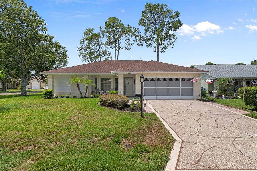 Photo of 7196 Crown Oaks Drive, Spring Hill, FL 34606 (MLS # W7887491)