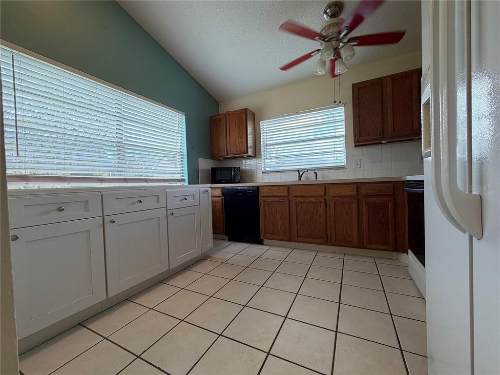 Photo of 13015 Baltimore Woods Lane, Orlando, FL 32824 (MLS # O6436730)