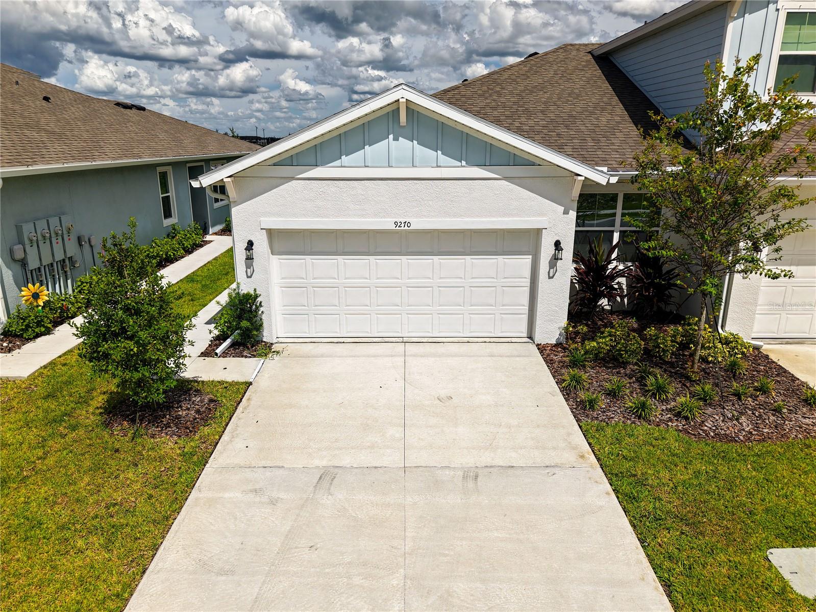 Discover modern comfort and resort-style living in this beautifully crafted single-story Manatee townhome at 9270 Gulf Haven Drive in Parrish, Florida. Located in the sought-after Seaire community, this brand-new 2025 build features 3 spacious bedrooms, 2 full bathrooms, and 1,433 square feet of thoughtfully designed living space with an open-concept layout perfect for both everyday life and entertaining.
Step inside to soaring 9-foot-4 ceilings and elegant 8-foot interior doors that enhance the home’s bright, airy atmosphere. The kitchen is a chef’s dream, with quartz countertops, generous cabinetry, and modern stainless-steel appliances including a dishwasher, range, and microwave.
The serene primary suite offers a private retreat with a large walk-in closet and en-suite bathroom, while the split-bedroom floor plan ensures comfort and privacy for guests or family members.
Step outside to your covered lanai—ideal for morning coffee or evening relaxation. As part of a vibrant community, residents will soon enjoy access to an incredible array of upcoming resort-style amenities, including a 4.5-acre lagoon with sandy beach zones, private cabanas, water slides, floating obstacle courses, and a full-service bar.
The community also features a playground, scenic sidewalks, and a sparkling pool, all included in the HOA. Located near top-rated schools and surrounded by thoughtfully designed infrastructure, this home combines comfort, style, and lifestyle-focused living in one perfect package.