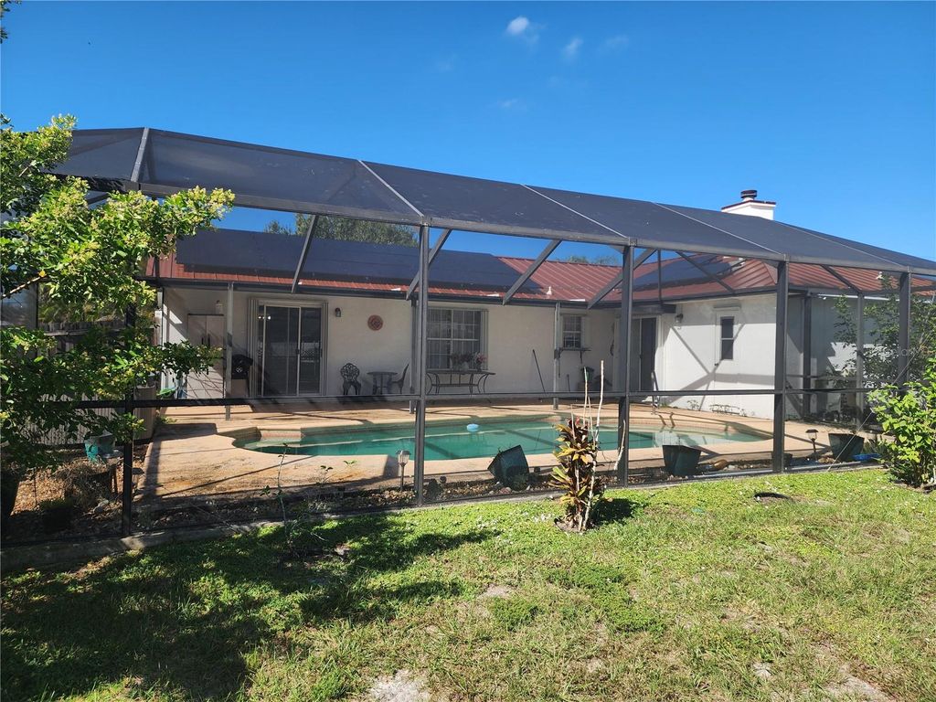 Photo of 4089 SW Kamsler Street, Port Saint Lucie, FL 34953 (MLS # TB8439870)