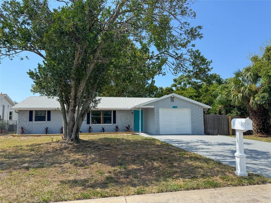 If you are looking for a fully remodeled true 4 bedroom, 3 bath house with a family room/bonus room, a garage on just under a quarter acre fully fenced, your search is over!  This home features a BRAND NEW 30 YEAR DIMENSIONAL ROOF AND A BRAND NEW 3.5 TON HVAC SYSTEM so your big ticket are taken care of for many years.  NO FLOOD ZONE!  The home boasts recent updates with a modern/contemporary flair! New paint inside and out.  Tile wood look flooring throughout for easy cleaning.  Grey shaker kitchen cabinets with quartz countertops, eye catching backsplash and brand new stainless steel appliances.  New modern lighting and ceiling fans, new 6 panel doors, newer hot water heater and all bathrooms have been recently updated with grey shaker cabinets, quartz countertops and beautiful tile in the tub/shower combos.  Your primary bedroom has it's own personal en-suite bathroom.  Bedroom #2 also has it's own personal en-suite bathroom.  You have a large living room and family room.  You have laundry hookups in the garage. Newer water heater and electrical panel.  Outside you have a nice sized yard out front and you can enjoy your days and evenings in the large fenced backyard with a 18x8' screened porch! The property is located in desirable Port Richey and is just minutes from great restaurants, plenty of shopping, and several beautiful parks and a quick ride to Tampa or the beaches! There is NO HOA, NO Deed Restrictions, and NO Flood Insurance required. This home would be great for a 1st time buyer, vacation home, or even move-in ready rental home!  Buyer to verify all room sizes.