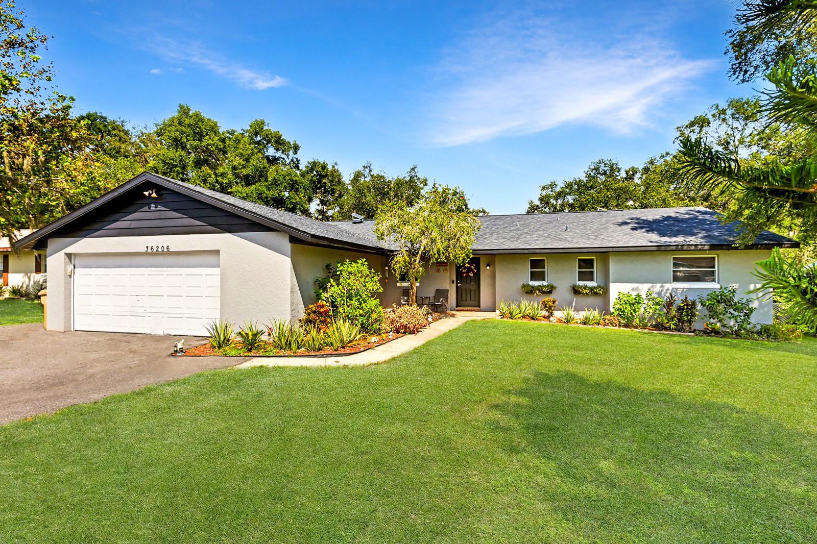 Welcome to this beautifully maintained POOL HOME! This 4 bedroom, 2 bathroom residence offers 1,845 sq. ft. of comfortable living space on a fully fenced 0.27-acre lot with peaceful lake and pasture views.
The home has been thoughtfully updated over the years with a 4-year-old roof, energy-efficient thermal windows in the living room, AC (2021), fresh exterior paint (2024), and an oversized driveway. The well features new pipes and a 3-year-old pump, while the septic tank drain field was replaced in 2022. The two-car garage includes added lighting and attic space for convenience.
The kitchen is both stylish and functional, featuring upgraded cabinets and newer appliances, refrigerator and stove (1 year), dishwasher and microwave (2 years). Inside, you’ll enjoy inviting living spaces with luxury vinyl flooring recently installed. The home’s block and stucco construction on a slab foundation ensures lasting durability.
Step outside to your private screened-in pool and porch, perfect for entertaining or simply relaxing. Additional highlights include a widened driveway, updated systems, and a quiet setting with beautiful views.
This Fruitland Park gem is move-in ready and ideal for families, investors, or anyone seeking the perfect balance of updates, charm, and outdoor enjoyment. Conveniently located near shopping, dining, recreation, and the brand-new Fruitland Park Elementary School!
