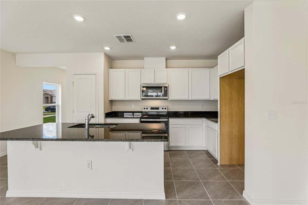 Photo of 679 Meadows Edge Place, Lake Wales, FL 33859 (MLS # O6431598)