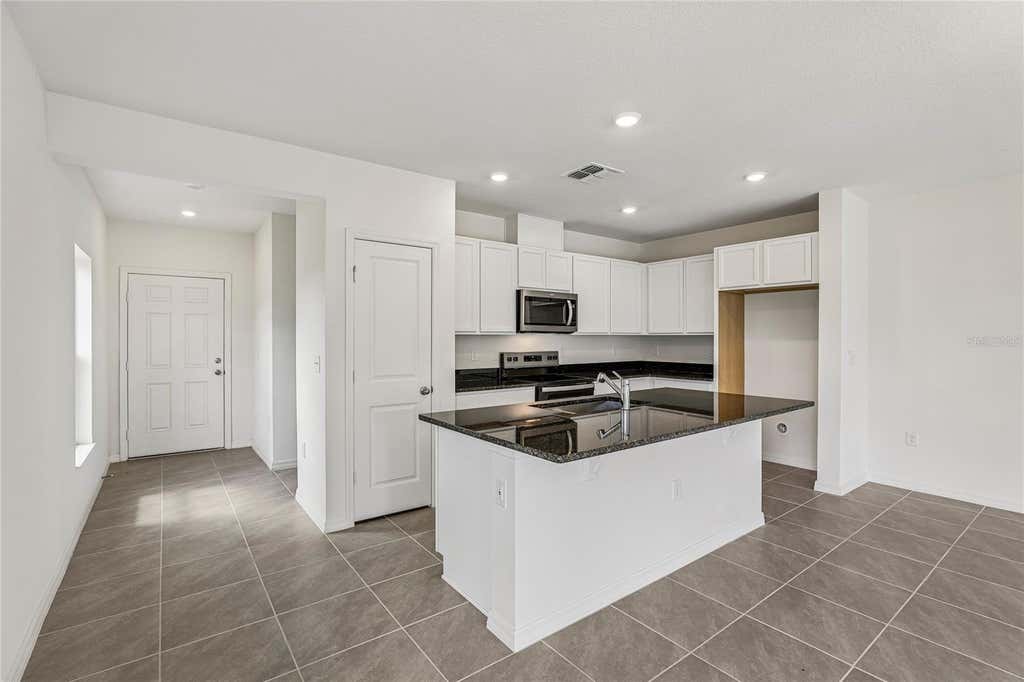 Photo of 679 Meadows Edge Place, Lake Wales, FL 33859 (MLS # O6431598)