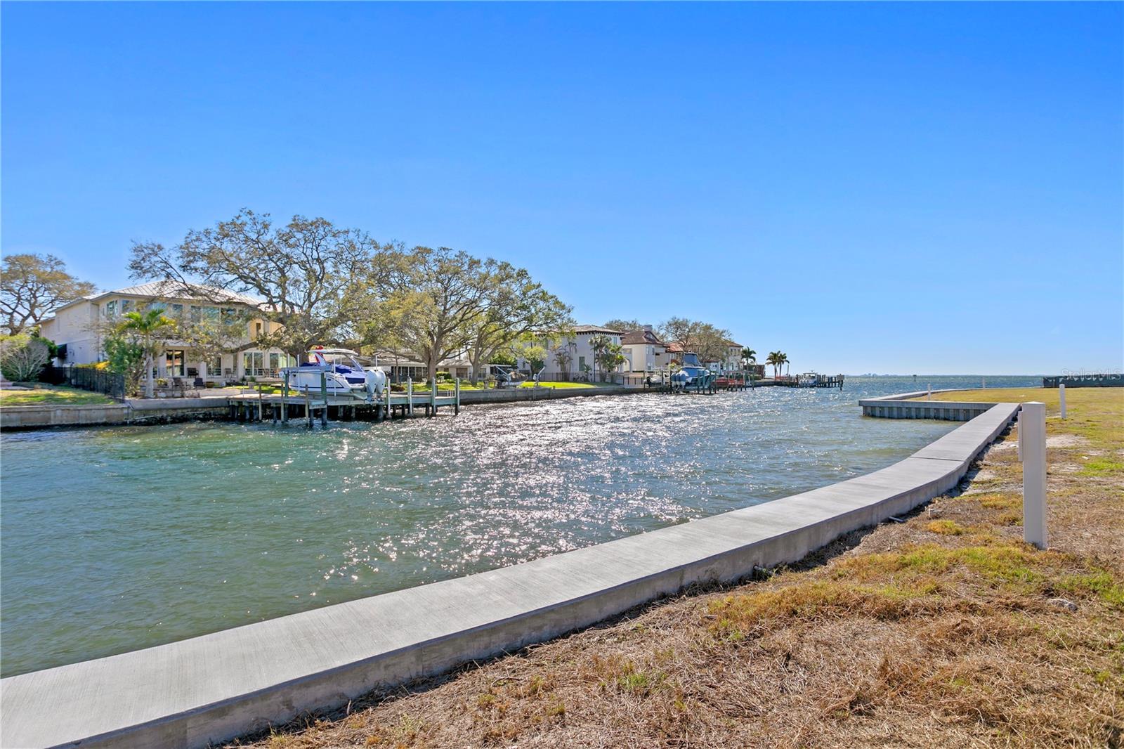 Best value waterfront in South Tampa - Only one lot remains! Welcome to Madsen Isles, a brand-new luxury waterfront enclave of 8 homesites. Bring your own builder or work with the developer to customize an available plan. This waterfront lot has a new seawall, no trees and is ready for a new home and dock to be built. This luxury community features 6 waterfront and 2 off-water homesites, buried underground utilities and a beautiful brick paver road. Residences will be a minimum of 5,000 sq ft in size, many offering generous car parking under the home and stunning water views from rooftop terraces. Madsen Isles is located in the Westshore area with A-rated schools and convenience to all that Tampa Bay has to offer. Minutes to Tampa International Airport, shopping/dining, sports venues, and downtown Tampa, while still offering easy access to the beaches and resort areas. Explore the many possibilities for this grand waterfront property.