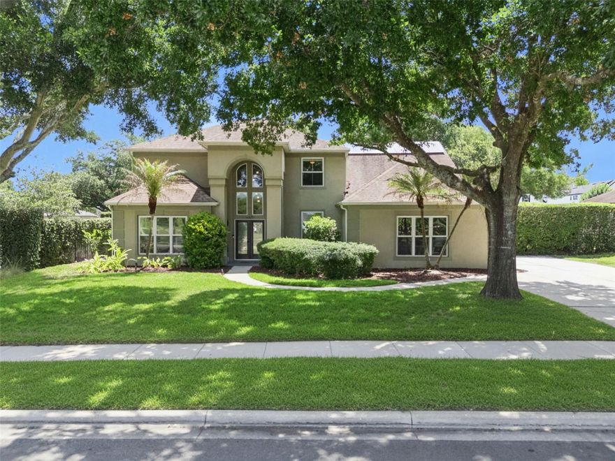 One or more photo(s) has been virtually staged. Step into the best of Central Florida living at this spacious 4-bedroom, 2.5-bath pool home on a generous 0.33-acre homesite in Orlando’s sought-after gated community of Porter Place. Designed for everyday comfort and effortless entertaining, the home opens to soaring ceilings, warm wood flooring, a dramatic great room with built-ins and a wood-burning fireplace, and expansive windows and sliders that frame the screened pool and spa beyond. The kitchen keeps everyone connected with a wide pass-through to the great room, stainless steel appliances, abundant cabinetry, an island, and an eat-in area overlooking the outdoors.

The first-floor layout offers exceptional flexibility with a private primary suite, formal living room, formal and casual dining areas, laundry room, powder bath, and direct flow to the oversized screened lanai. Upstairs, three additional bedrooms, a full bath, and a spacious bonus room loft to gather, work, study, host, or unwind. Outside, the resort-style pool area is the heart of the home, featuring a screened enclosure, spa, expansive deck space, cafe lighting, updated exterior lighting, privacy landscaping, and multiple access points from the living areas.

Major improvements add confidence and comfort, including a 2016 roof with transferable GAF warranty, full PEX re-plumbing, solar panels, high-efficiency Trane HVAC systems, upgraded Pella and WinDoor low-E windows and doors, whole-house water softening and filtration, AT&T Fiber, smart irrigation, Ring cameras, and extensive pool updates including resurfacing, LED lighting, heater, solar heating, and automated controls. Recent 2024–2026 enhancements include exterior lighting and landscaping, an updated staircase with custom woodwork and horizontal metal railing, a 72-inch smart great-room fan, updated entry chandelier, and refreshed baths. Close to Downtown Orlando, SoDo, Lake Como, parks, dining, hospitals, major roadways, and Orlando International Airport, this home delivers the space, upgrades, and indoor-outdoor lifestyle buyers are looking for.