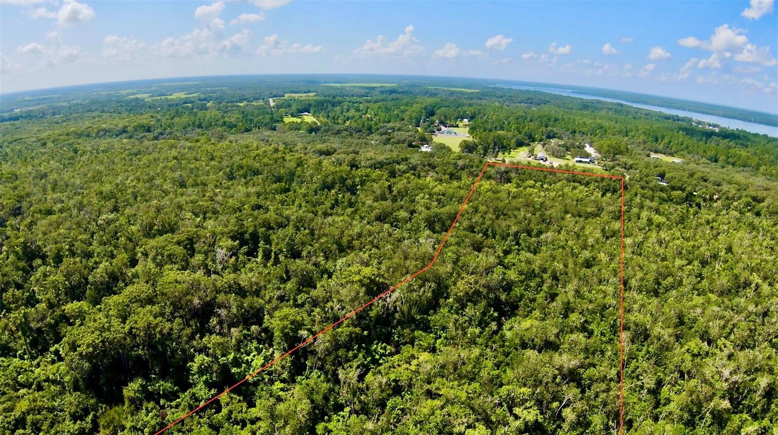 Don't miss this rare chance to own about 22 acres of undeveloped land on the scenic St. Johns River in East Palatka. With beautiful river frontage, stunning views, and endless possibilities, this property is perfect for a private estate, peaceful retreat, or future investment. Enjoy the natural beauty and privacy of Old Florida while still being close to nearby towns and amenities. Make your vision a reality on this remarkable piece of riverfront land.
