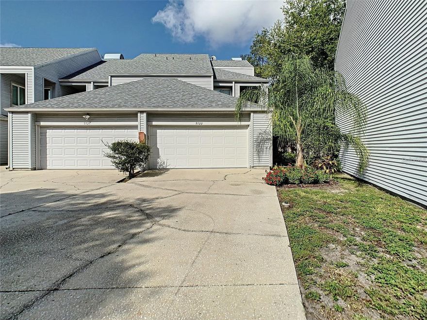 Prepare to be impressed when you enter this beautifully remodeled, move-in ready condo in the heart of Carrollwood. Spanning nearly 2,500 sq. ft., this expansive 3-bedroom, 3-bathroom home with a 2-car garage offers an abundance of space and style. The open, airy floor plan showcases beautiful new wood flooring throughout, and a grand entryway that flows into a light-filled living and dining area, enhanced by contemporary light fixtures. The gourmet kitchen, remodeled in 2020, is a chef’s dream, featuring soft-close custom cabinetry, a farmhouse sink, Quartz countertops, and a reverse osmosis water system. All new appliances, including a washer and dryer, are included in the spacious laundry room. The three bathrooms have all been thoughtfully remodeled, each featuring custom vanities, new granite countertops, and designer finishes. Crown molding and meticulous attention to detail elevate every room in this end-unit condo. A custom wood-burning fireplace and a chic wet bar with a wine fridge make the living area perfect for both relaxation and entertaining. Additional upgrades include built-in cabinetry throughout, a water softening system, and a completely remodeled master bathroom (2025) with a massive rain shower, custom fixtures, and an elegant new sink. The master bedroom also features newly updated built-in closets (2025). To top it all off, enjoy the serene outdoors from your brand-new screened-in back porch, added in 2020. This home is a true sanctuary, combining modern luxury with everyday comfort. This condo is part of Tiffany Oaks Lakeside Condominium, a private and gated community. Lake access gives you a scenic water element and peaceful views along with a community pool. You’ll enjoy easy access to Busch Boulevard and Armenia Avenue for quick ingress/egress as well as close proximity to Dale Mabry Highway. This property is a must see. Call today to schedule your private showing.
