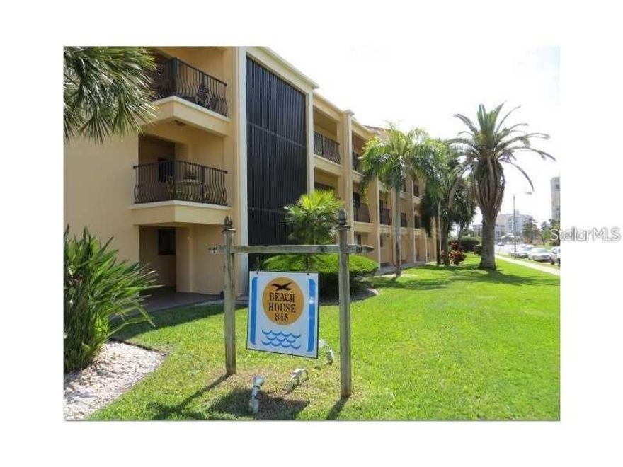 Here is your chance to own a beautiful, turn-key, ground floor, totally remodeled 2BR/2BA condo with a private beach. Could also be the prefect rental investment property as community permits ST rentals (3 mth. min.)  Brand new kitchen, appliances and all new furniture and accessories throughout. Close to the waterside pools and beach area of the community. Unit has tile flooring, open and bright layout. There is a nice patio sitting area just outside the LR slider and it has a nice area to relax outside. The living room has the perfect view of the beautiful grounds, the pool area...the private beach and all amenities are just steps away. Take a stroll along the private beach, relax and watch the boats go by and the dolphins frolic in the sunshine. Enjoy a swim in the updated, oversized heated pool or take a relaxing dip in the spa. When evening comes, it is the perfect time to take a walk along the powder sand private beach for some star gazing. This community is impeccably cared for and boasts tennis courts, pickle ball, shuffleboard, a storage area, extra laundry room in the building if you need it, a carwash area, outdoor pool shower, and a large waterside lounging/grilling area. The condo has 1 covered parking space and parking is permitted on S Gulfview in front of the building. Lots of ample guest parking too. Walk to all the popular restaurants and shops close by or venture out on the beach trolley. Clearwater Beach is full of fun and excitement at any time of the day. Literally…all you need is here. Live the vacation you always dreamed of right here at the Beach House on Clearwater point. You don’t want to miss this opportunity!