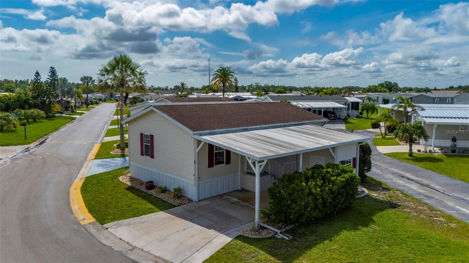 Port Charlotte Village was voted #1 Manufactured Home Community in 2024. * Not in a Flood Zone **Discover this beautifully furnished 2-bedroom, 2-bathroom manufactured home located in a peaceful 55+ community with a low HOA. This inviting corner-lot home offers a comfortable and functional layout featuring two spacious primary suites, each with its own private bathroom and large walk-in closet—perfect for guests or multi-generational living. The oversized living room provides plenty of space to relax or entertain, while the large, open kitchen includes ample cabinetry and counter space, making it ideal for cooking and hosting. Step outside to a long, covered carport that easily fits multiple vehicles and includes a large storage shed—great for tools, hobbies, or beach gear. Enjoy mature curbing and well-maintained landscaping that wraps around the property, adding to its charm and curb appeal. Located just minutes from top-rated golf courses, waterfront dining, fishing piers, shopping centers, entertainment venues, and Florida’s stunning beaches, this home offers the perfect blend of comfort and convenience. Whether you're looking for a seasonal retreat or full-time residence, this home is move-in ready and waiting for you!
