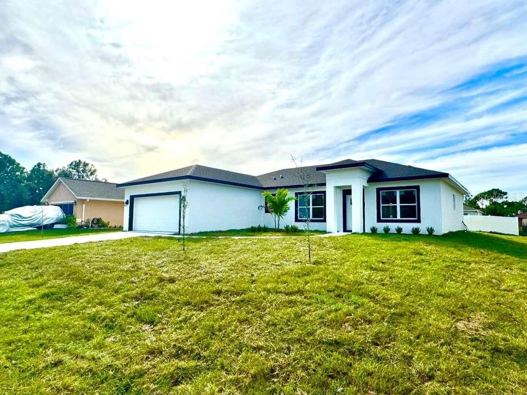 Photo of 714 Santo Domingo Avenue SW, Palm Bay, FL 32908 (MLS # O6359026)