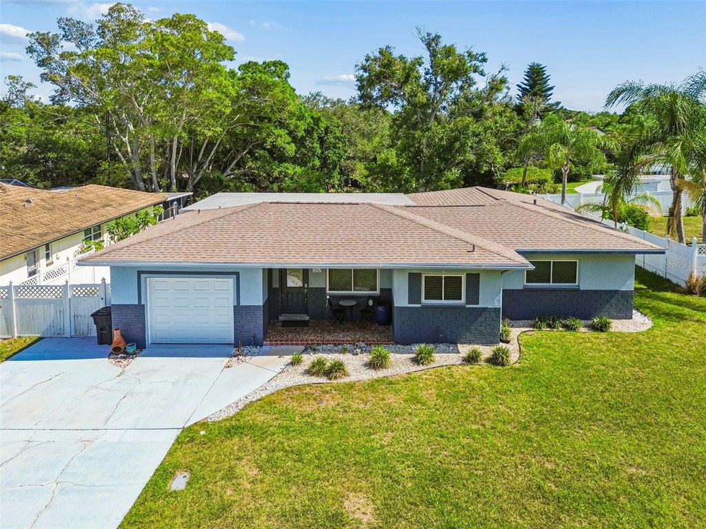 Photo of 3282 Honeysuckle Rd, Largo, FL 33770 (MLS # TB8524853)