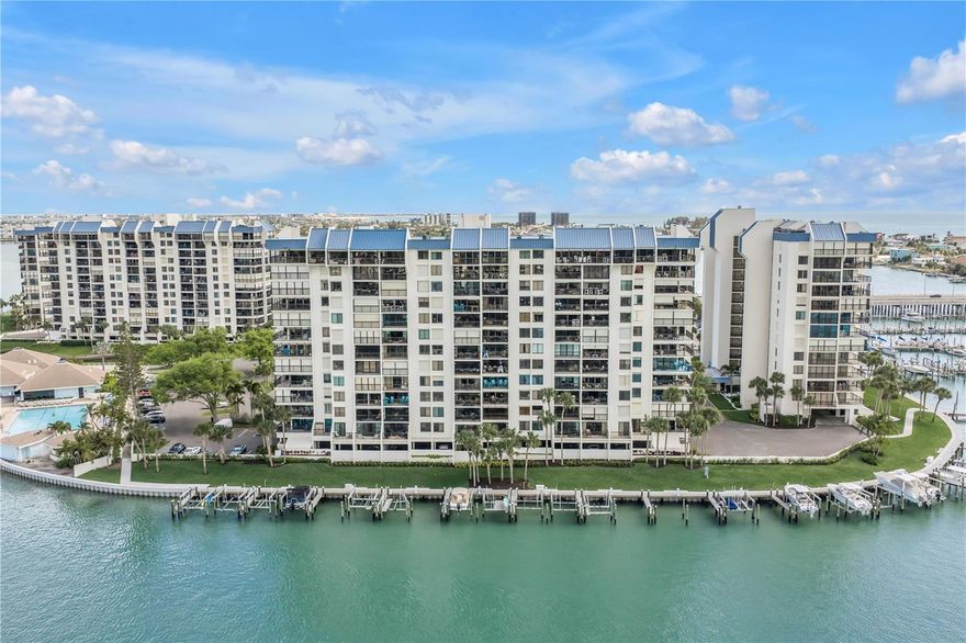 Welcome to coastal luxury living at the Yacht and Tennis Club of St. Pete Beach! This rare CORNER UNIT is a beautifully updated 2-bedroom, 2-bath condo being sold fully furnished—just bring your suitcase and start enjoying the Florida lifestyle.
Step inside to a spacious, light-filled layout featuring breathtaking water views from every angle. The open-concept living area flows effortlessly onto a large wrap-around balcony, perfect for soaking in the ocean breeze, watching dolphins play, and enjoying the very best of waterfront living.
The kitchen offers granite countertops, ample storage with a breakfast bar and custom blinds throughout the condo. This move-in-ready residence also features a 2023 A/C, 2025 water heater, updated impact windows, and storm shutters for added peace of mind. Both bedrooms offer a walk-in closets with a split floor plan. 
The Yacht and Tennis Club has recently undergone impressive enhancements, including a brand-new seawall and beautifully refreshed grounds with lush tropical landscaping and palm trees elevating the community’s already resort-style feel.
Residents enjoy exceptional amenities, including 7 Har-Tru clay tennis courts, 4 pickleball courts, a heated waterfront pool along the Intracoastal Waterway, a fully equipped fitness center, shuffleboard courts, and a newly updated clubhouse perfect for entertaining. The community is gated with 24-hour security, offering both privacy and peace of mind.
All assessments have been paid, and both the Milestone Inspection and Engineering Report have been completed and passed. The building roof was replaced in 2024.
Whether you're seeking a full-time residence, vacation getaway, or investment opportunity, this one-of-a-kind condo offers the perfect chance to own a slice of paradise in one of St. Pete Beach’s most desirable communities.