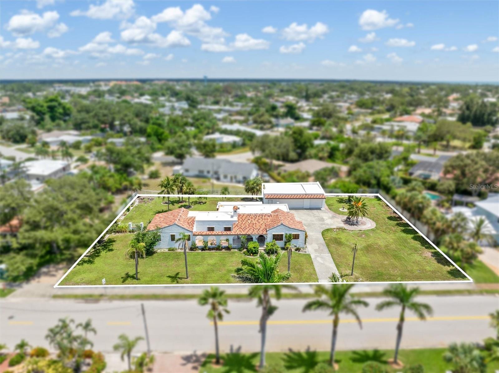 Welcome to this exceptionally unique and charming historic home on Venice Island! Located in the Venezia Park historic district this home has a special Old World vibe and is ready for your personal touches and renovations! With a new tile roof, and an oversized lot of approximately .62 acres, this property is a true island gem. The sidewalk-lined streets of Venezia Park give way to the beautiful community park just a few hundred feet away. Just a few blocks to the west, you’ll find Venice Beach, Casperson Beach, and Sharky’s at the Pier. The iconic Venice Jetties are close by as well. This sprawling three bedroom home has three and a half bathrooms, office and plenty of open areas in the dining room, oversized family room, as well as the living room. You’ll notice cool architectural details like the arched doorways and built-ins. There is a detached 3 car garage with workshop and utility area for all your storage needs. The oversized lot makes a true statement and gives plenty of room for enjoyment and privacy. This is the first time this home has been on the market in many decades- schedule your appointment to view this amazing property today!